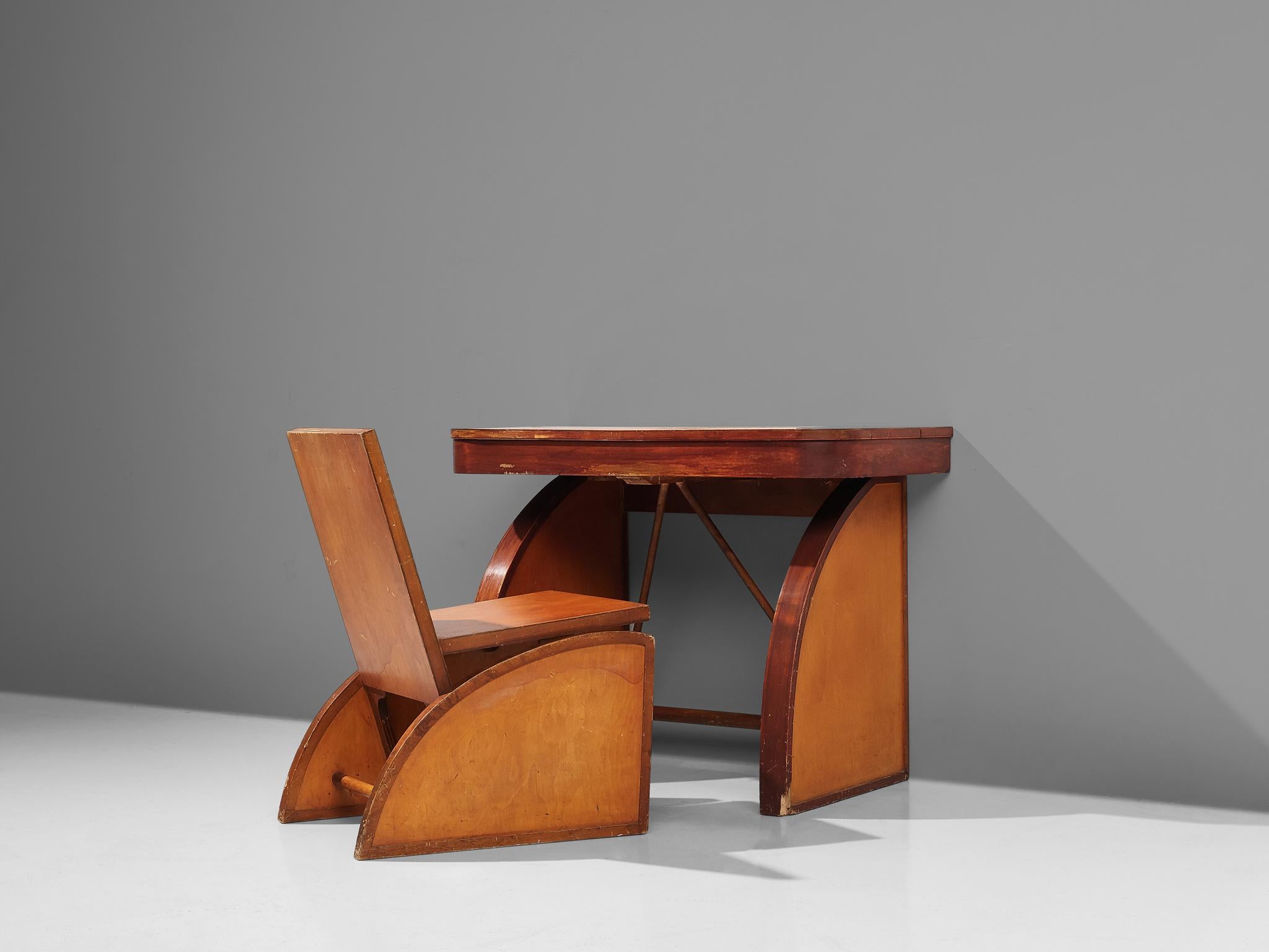 Brown Saltman, desk with chair, wood, United States, circa 1940s

A cubist desk with chair. This set holds a similar idiom with clear forms and lines. Both the chair and the desk are resting on triangular legs. These triangles have two angular,