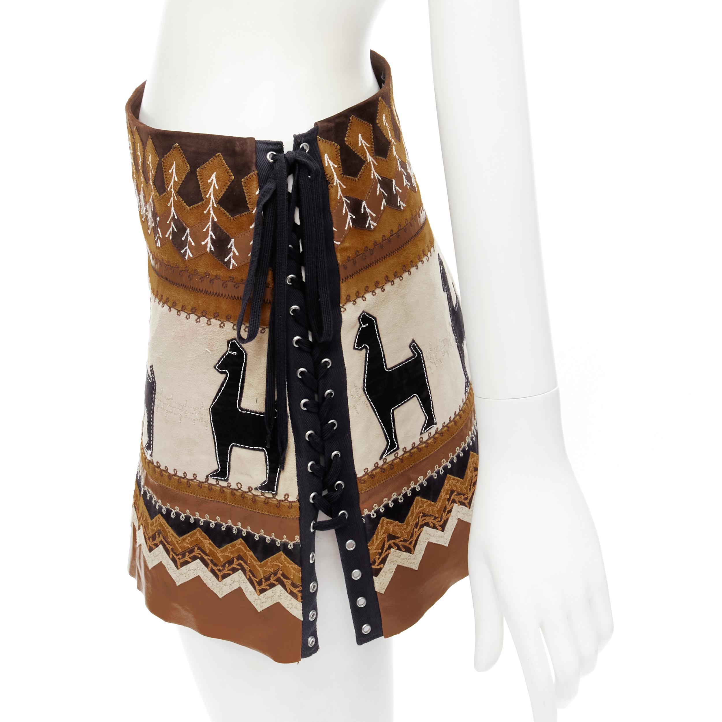 rare D&G DOLCE GABANNA Native American aboriginal aztec suede mini skirt S 
Reference: ANWU/A00565 
Brand: D&G 
Material: Suede 
Color: Brown 
Pattern: Ethnic 
Closure: Lace 
Extra Detail: Lace up sides. Patchwork suede leather. Rose floral lining