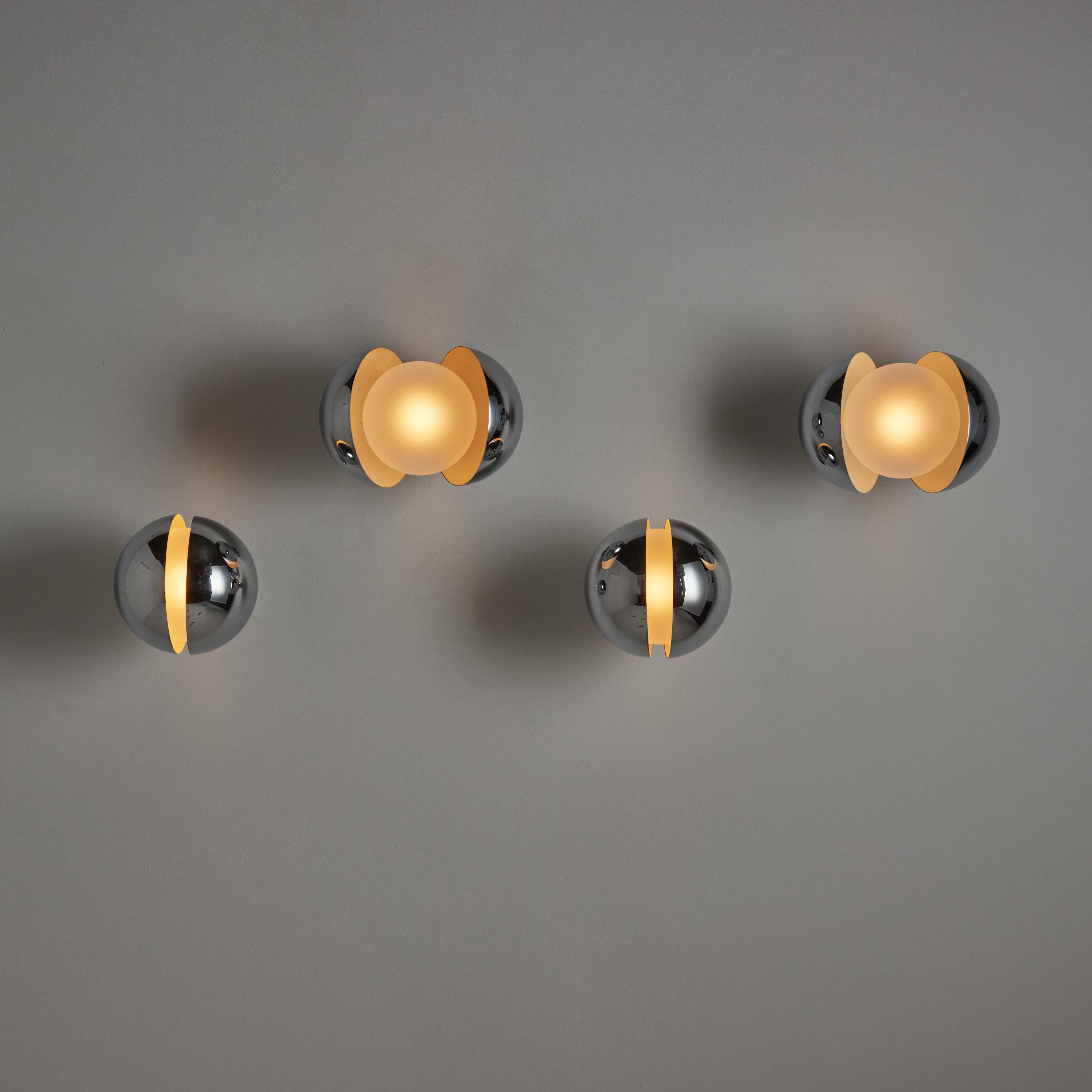 Rare 'Diaframma' Sconces by: G. Piero & A. Monti for Fontana Arte. Designed and manufactured in Italy, circa the 1960's. Butterfly sconces consisting of a chrome outer shell and clear etched glass globes. You can open and close the outer shells to