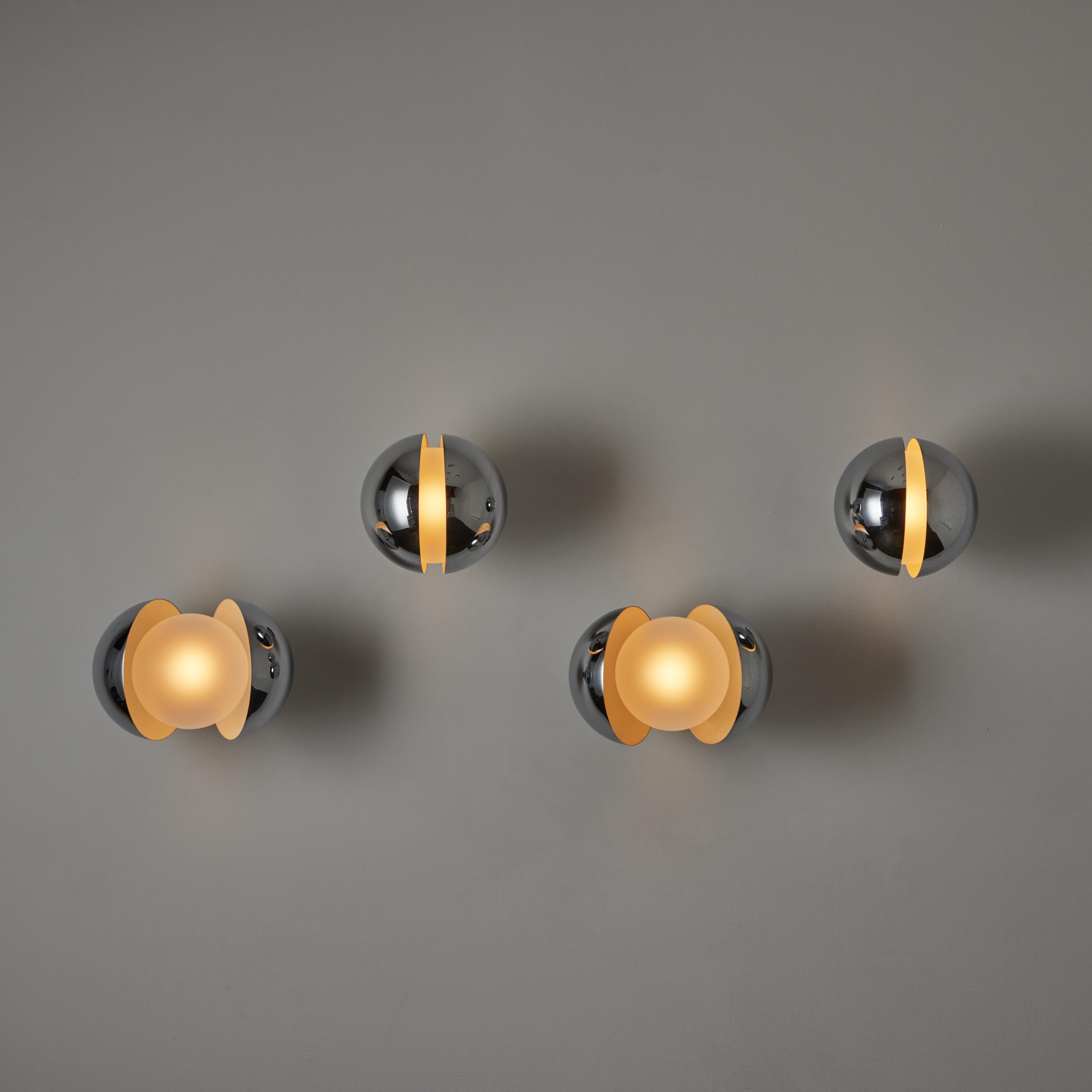 Rare 'Diaframma' Sconces by: G. Piero & A. Monti for Fontana Arte. Designed and manufactured in Italy, circa the 1960's. Butterfly sconces consisting of a chrome outer shell and clear etched glass globes. You can open and close the outer shells to