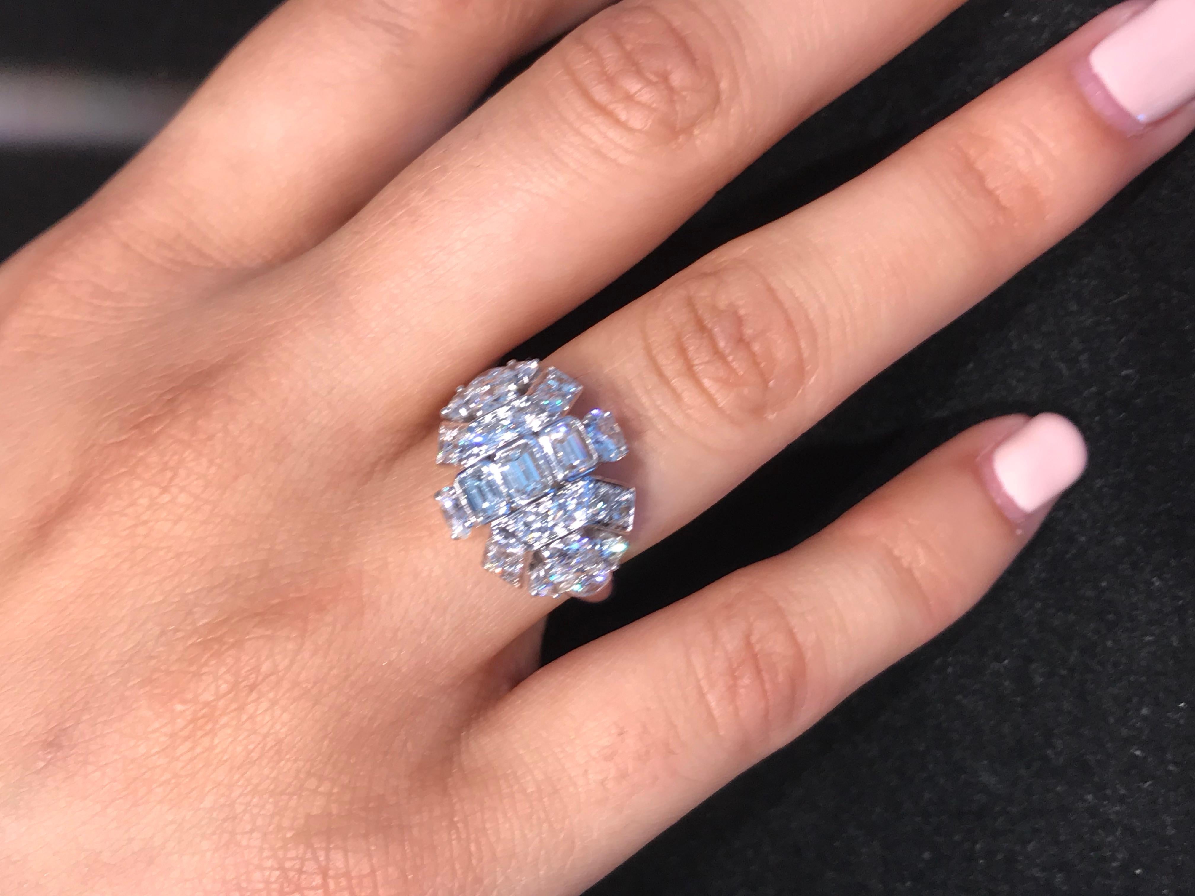 This Beautiful 18K White Gold Diamond Cluster Ring is by Collingwood Jewelers of London.  Collingwood Jewelers holds a Royal Warrant by her Majesty the Queen of England.  Established in the early 1960's many of their pieces were designed by Andre