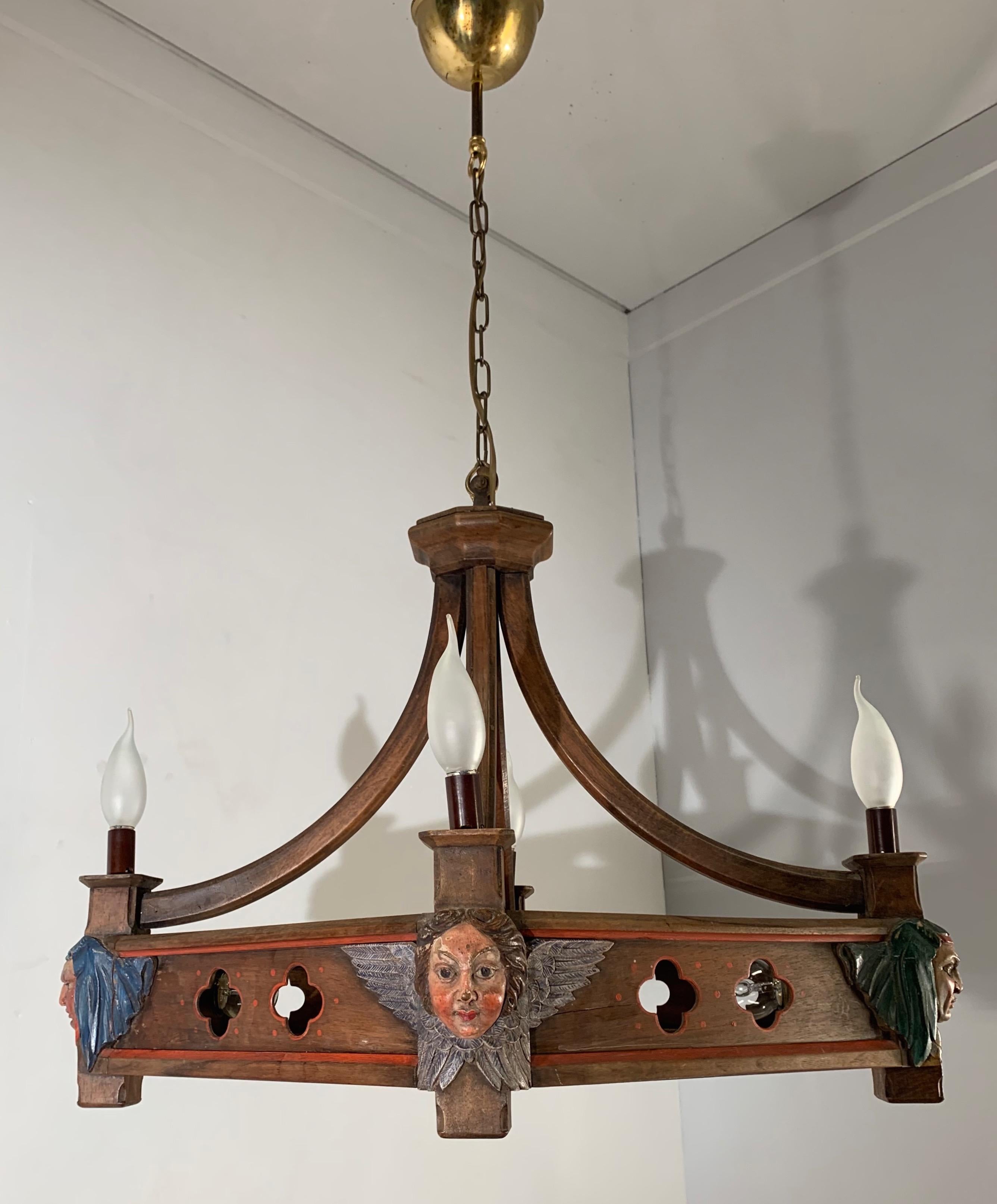 Unique and meaningful Gothic Revival pendant with hand carved and hand painted masks.

For the collectors of rare and quality crafted light fixtures, we also have this striking and meaningful 8 light, Gothic style fixture. This work of Gothic
