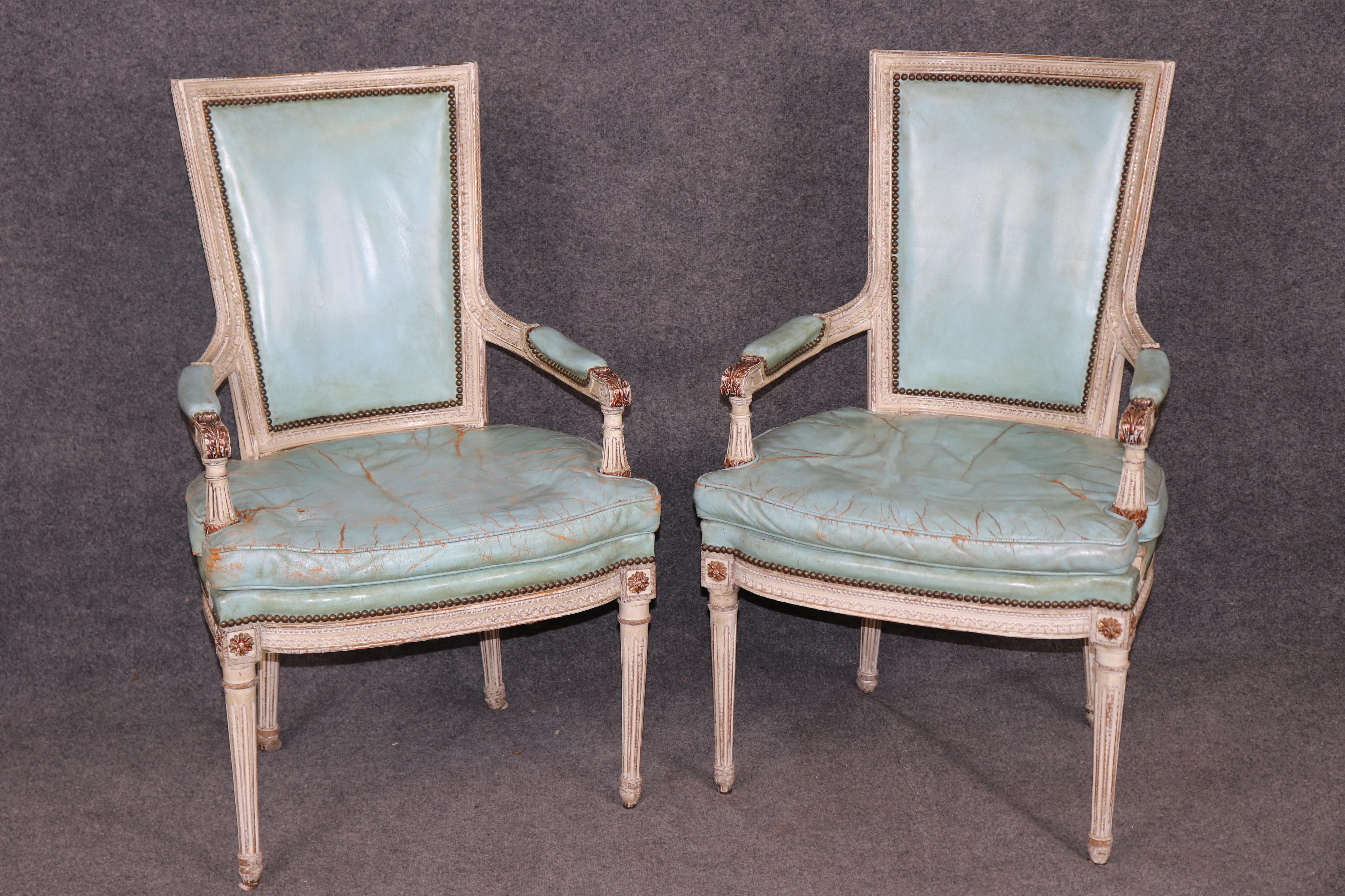 Presenting a rare set of 12 signed Maison Jansen French Louis XVI painted cane dining chairs, crafted with the elegance and refinement for which this legendary Parisian design house is renowned. Each chair features beautifully carved frames with