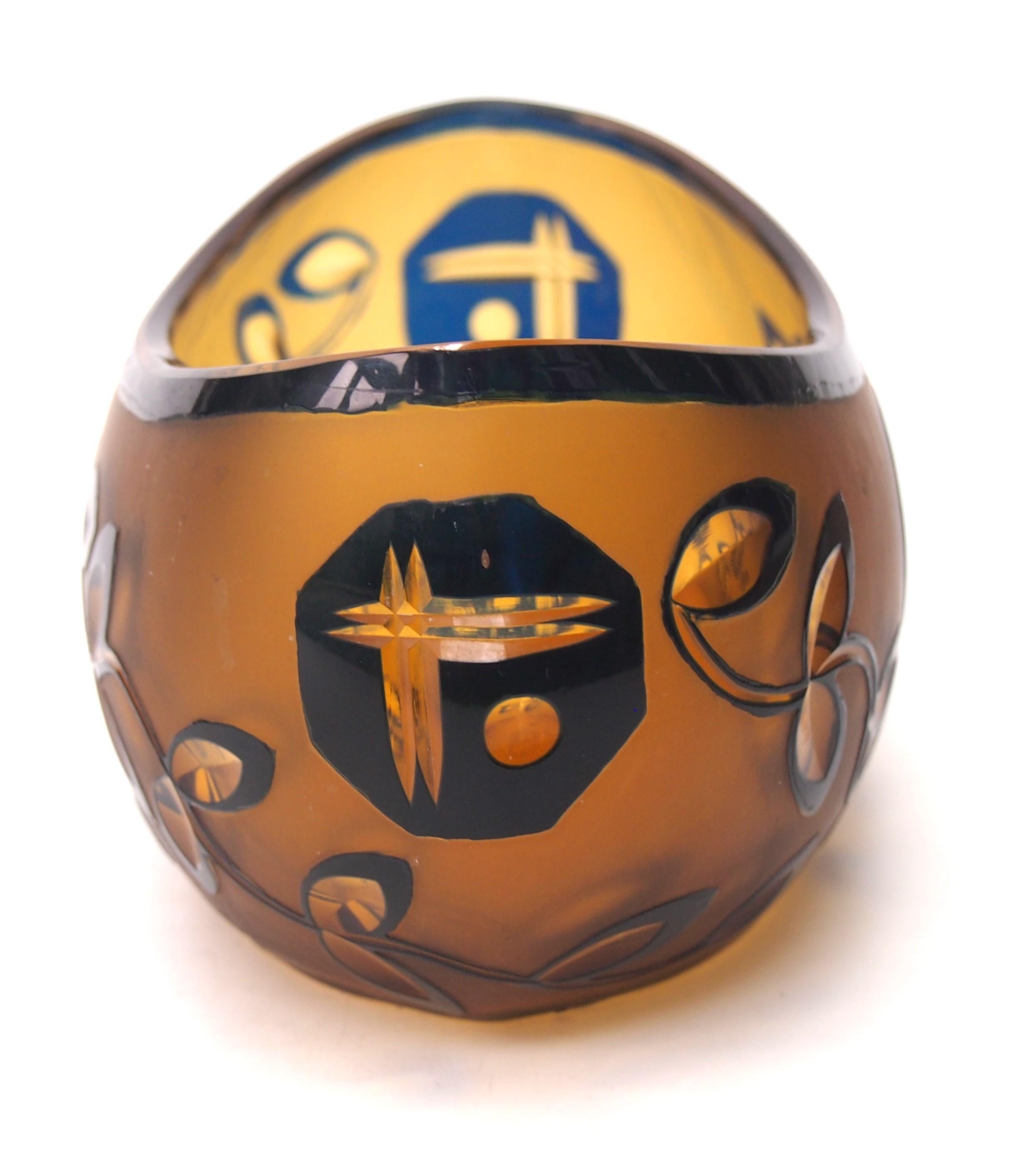 A rare high Art Deco blue over orange amber cut bowl, in a boat shape - it is cut with leaves and abstract patterns some cut to the Amber orange layer and some cut to clear - dating from 1925 or soon after - this bowl is in one of the recently
