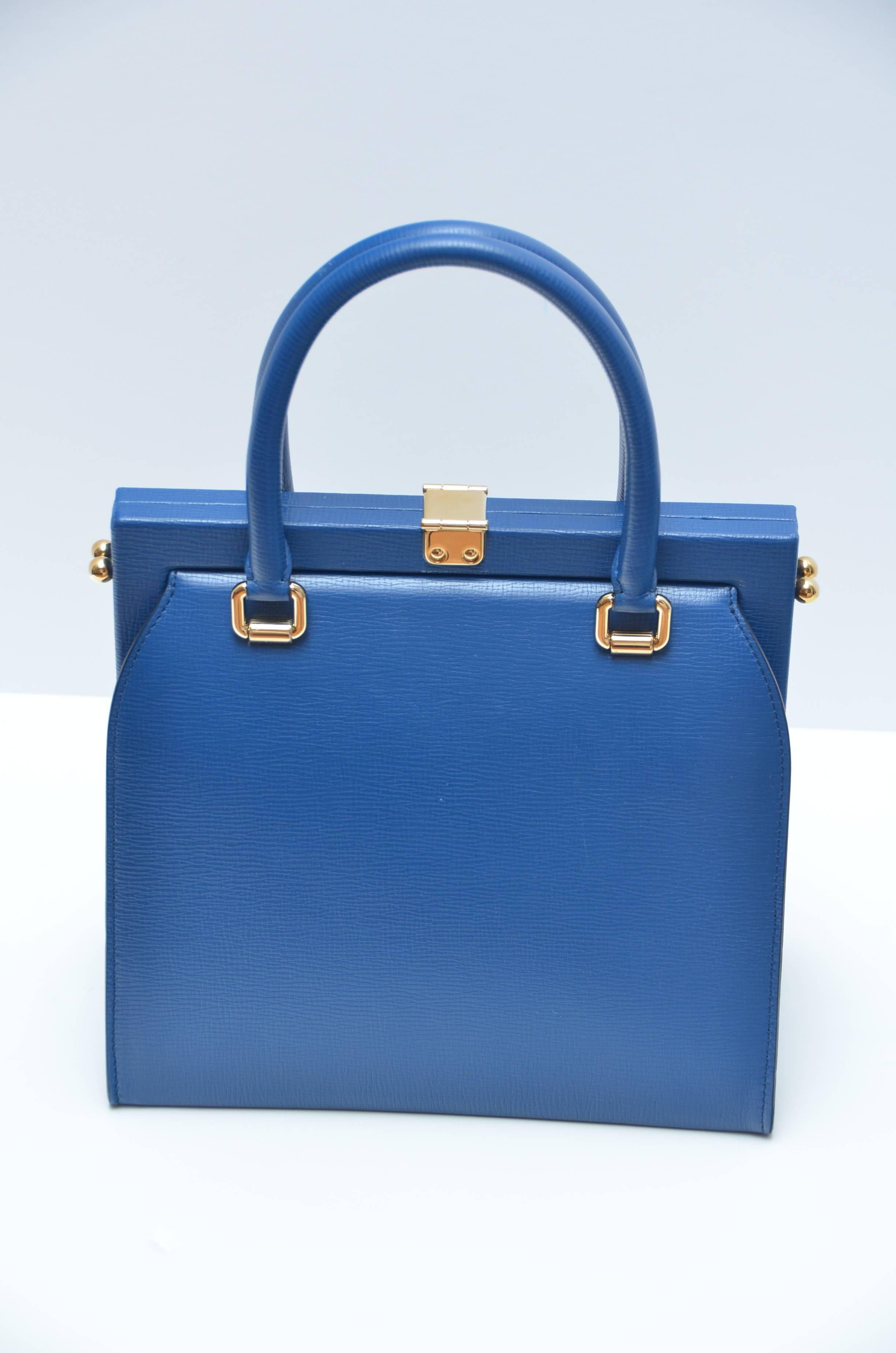 Dolce&Gabbana Pegasus Mini Pomellato Runway Handbag  
Blu Marino color.
Shoulder strap included.
New with tags.Couple minor marks on leather but bag still have clear plastic on hardware inside and lock in the front as well as tags