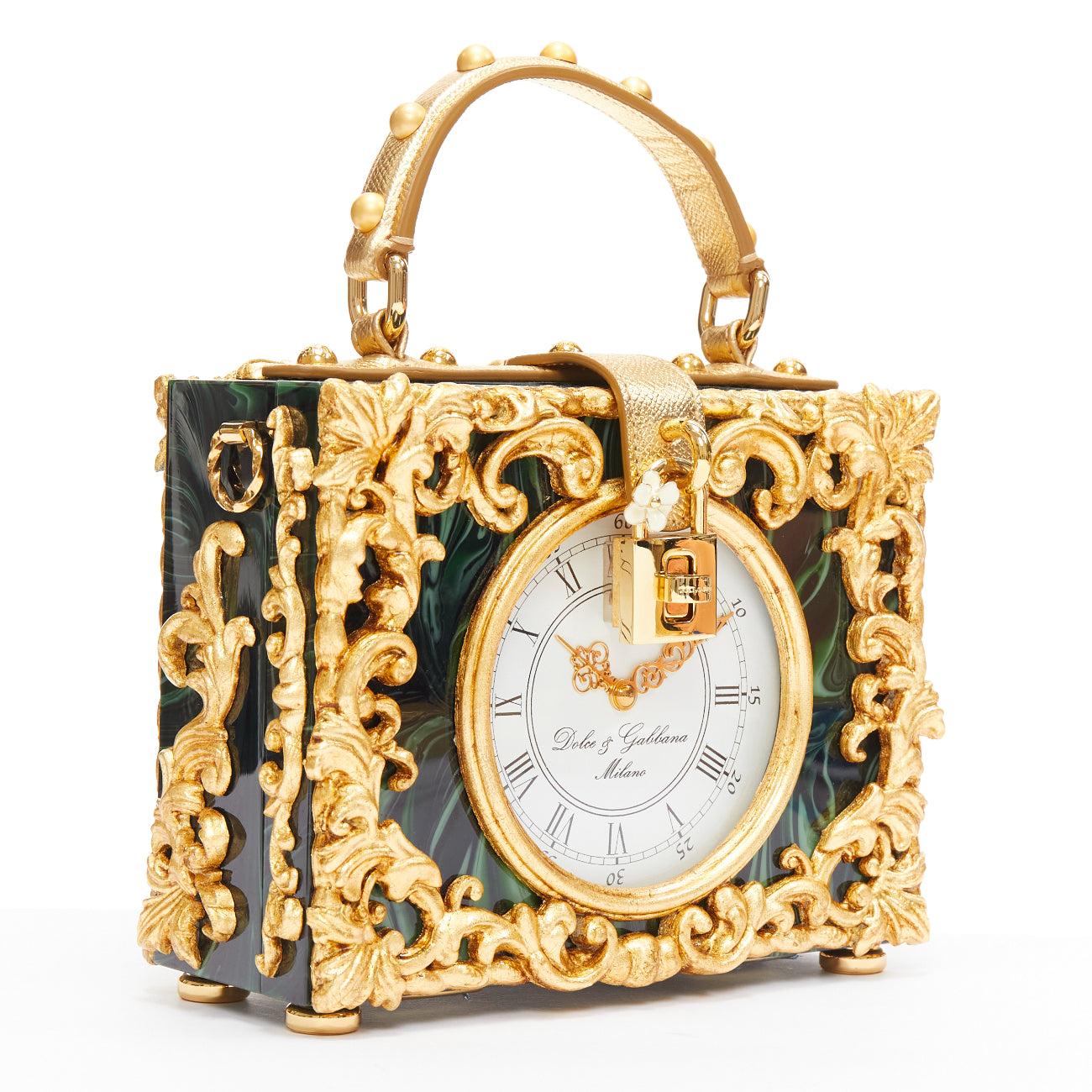 rare DOLCE GABBANA Box Orologio Barocco gold metal green marble resin vanity bag
Reference: TGAS/D01025
Brand: Dolce Gabbana
Designer: Domenico Dolce and Stefano Gabbana
Model: Box Orologio Barocco
Material: Acetate, Metal, Leather
Color: Green,