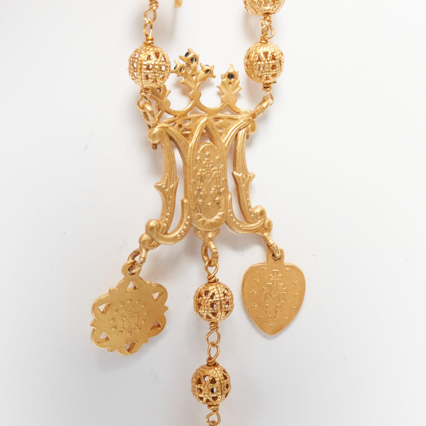rare DOLCE GABBANA gold tone Jesus cross Saints coin charm long rosary necklace
Reference: TGAS/D00183
Brand: Dolce Gabbana
Designer: Domenico Dolce and Stefano Gabbana
Material: Metal
Color: Gold
Pattern: Barocco
Closure: Pull On
Made in:
