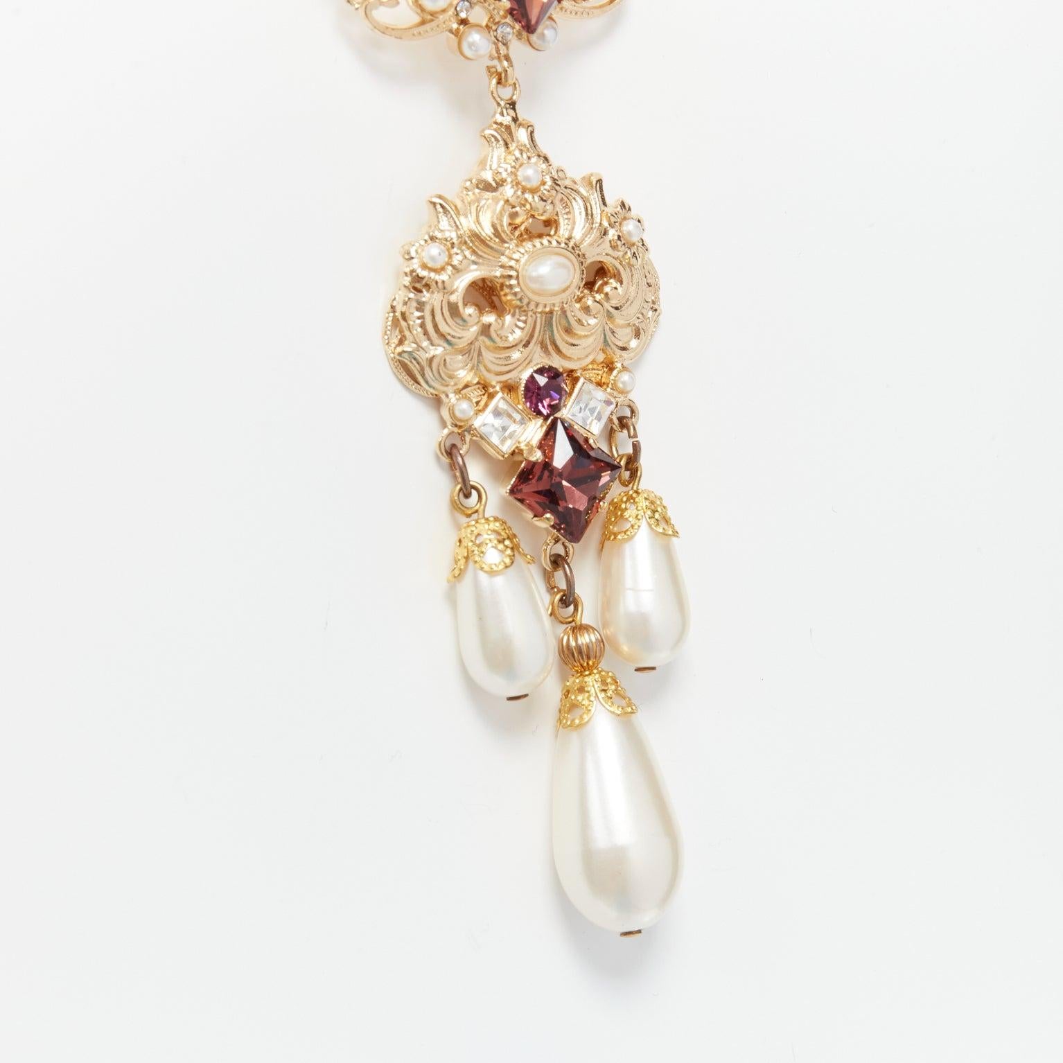 rare DOLCE GABBANA gold tone sapphire rhinestone pearl pendent filigree necklace
Reference: TGAS/D00184
Brand: Dolce Gabbana
Designer: Domenico Dolce and Stefano Gabbana
Material: Metal, Faux Pearl, Plastic
Color: Gold, Pearl
Pattern: