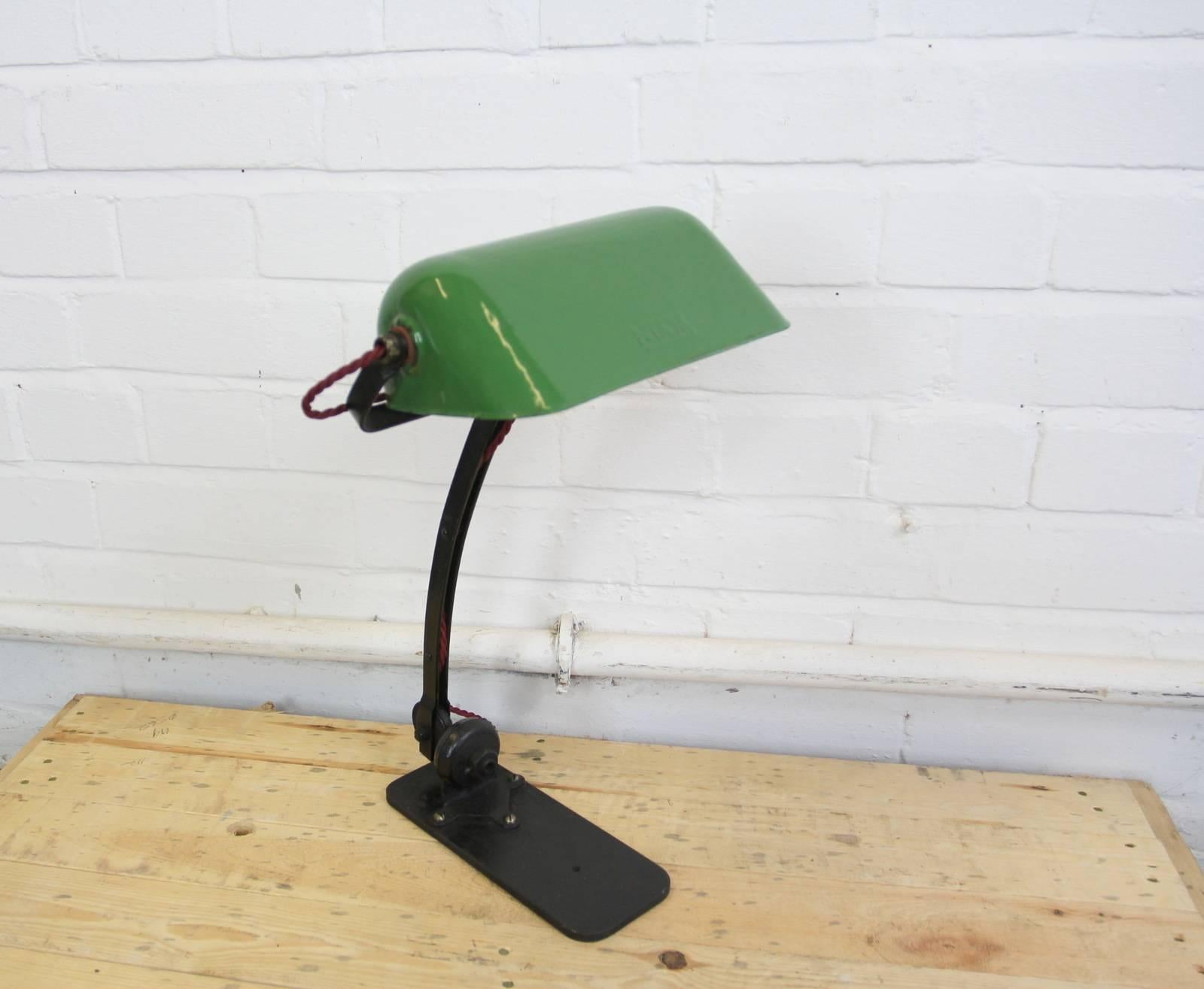 - Vitreous green enamel shade
- Embossed logo on the shade
- Double joint which allows the lamp to be adjusted into many angles
- Takes B22 fitting bulbs
- Would have originally been attached to an architects drawing board
- French, circa