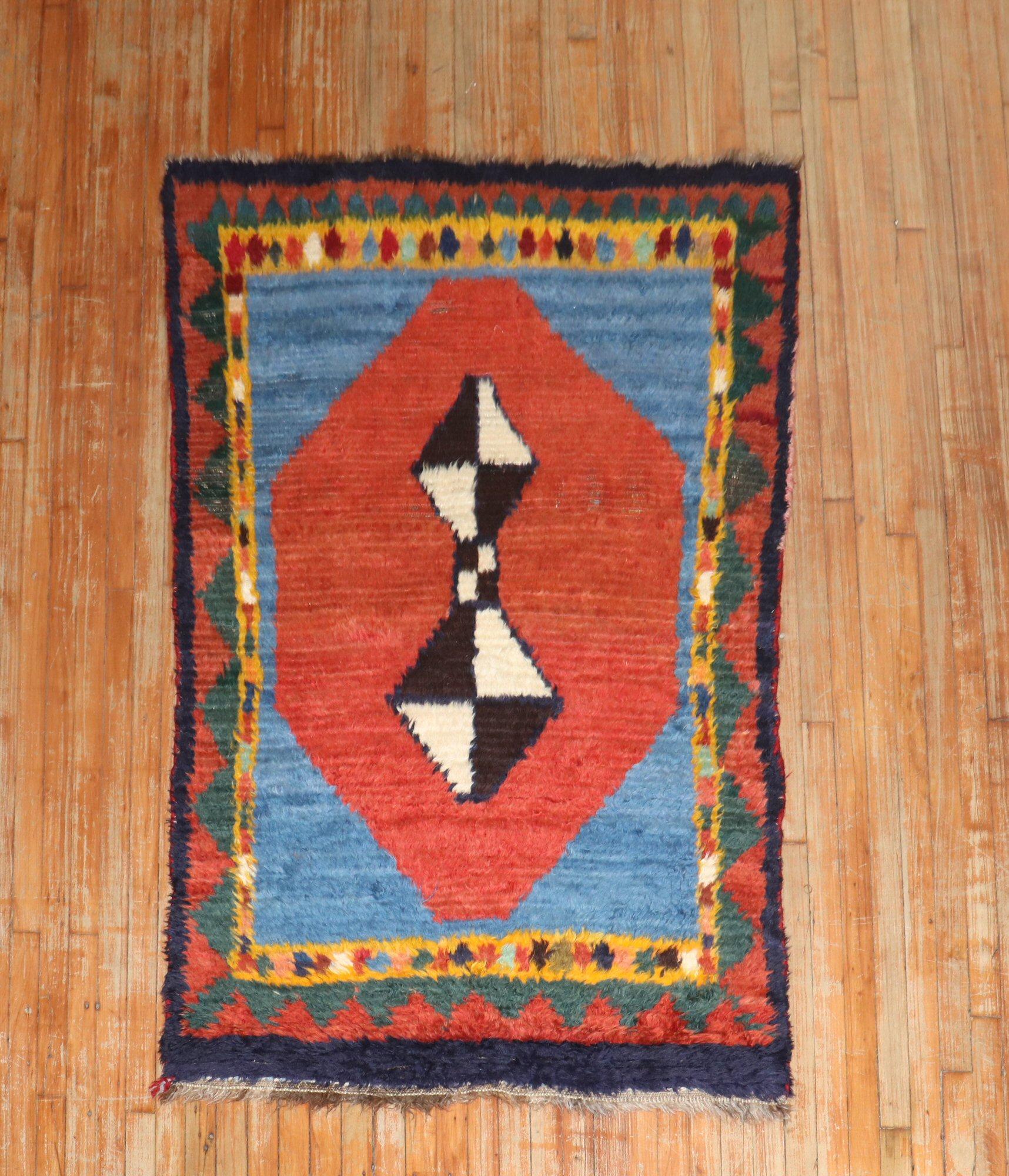 A 1st quarter of the 20th century Double Sised Persian Gabbeh accent-size geometric rug originating from the JP WILLBORG collection. primary-image shown shows 1 side of the rug. the other side consists of a checkerboard design seen in some of the