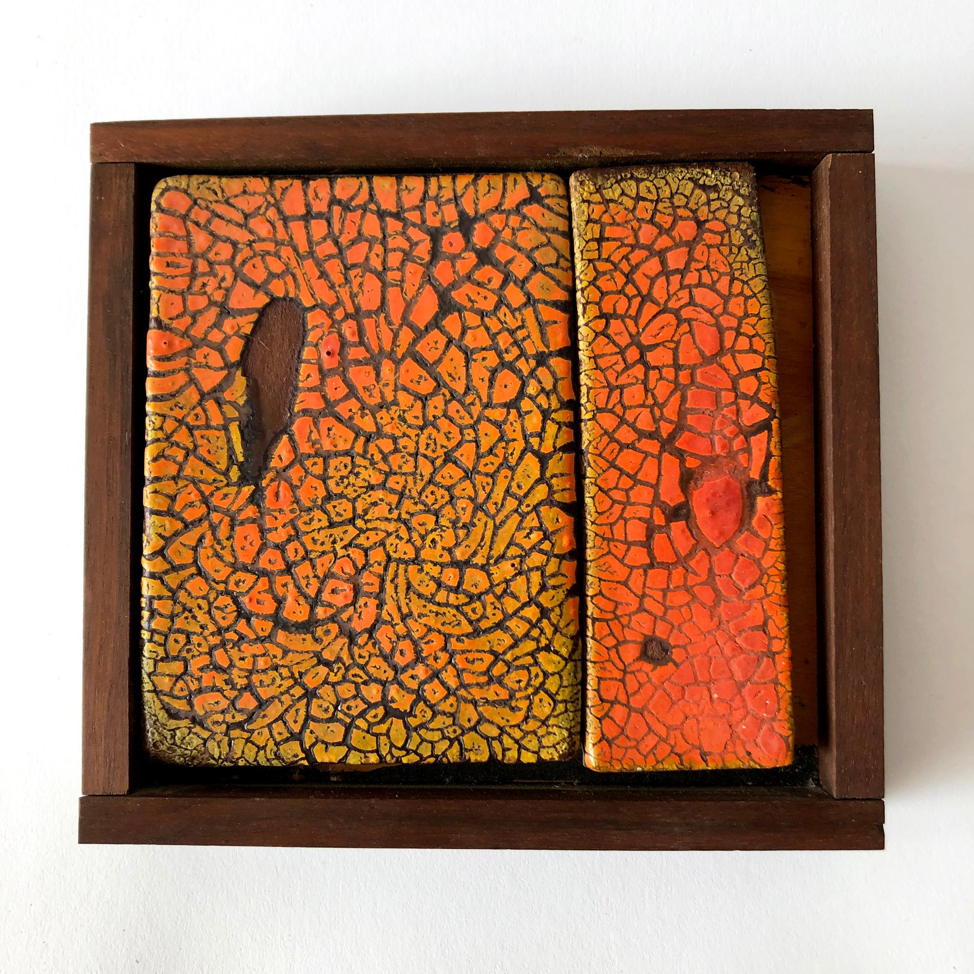 Rare, historical example of two tiles with craquelure glaze and framed in redwood, created by ceramist and sculptor Doyle Lane. Clay painting measures 7