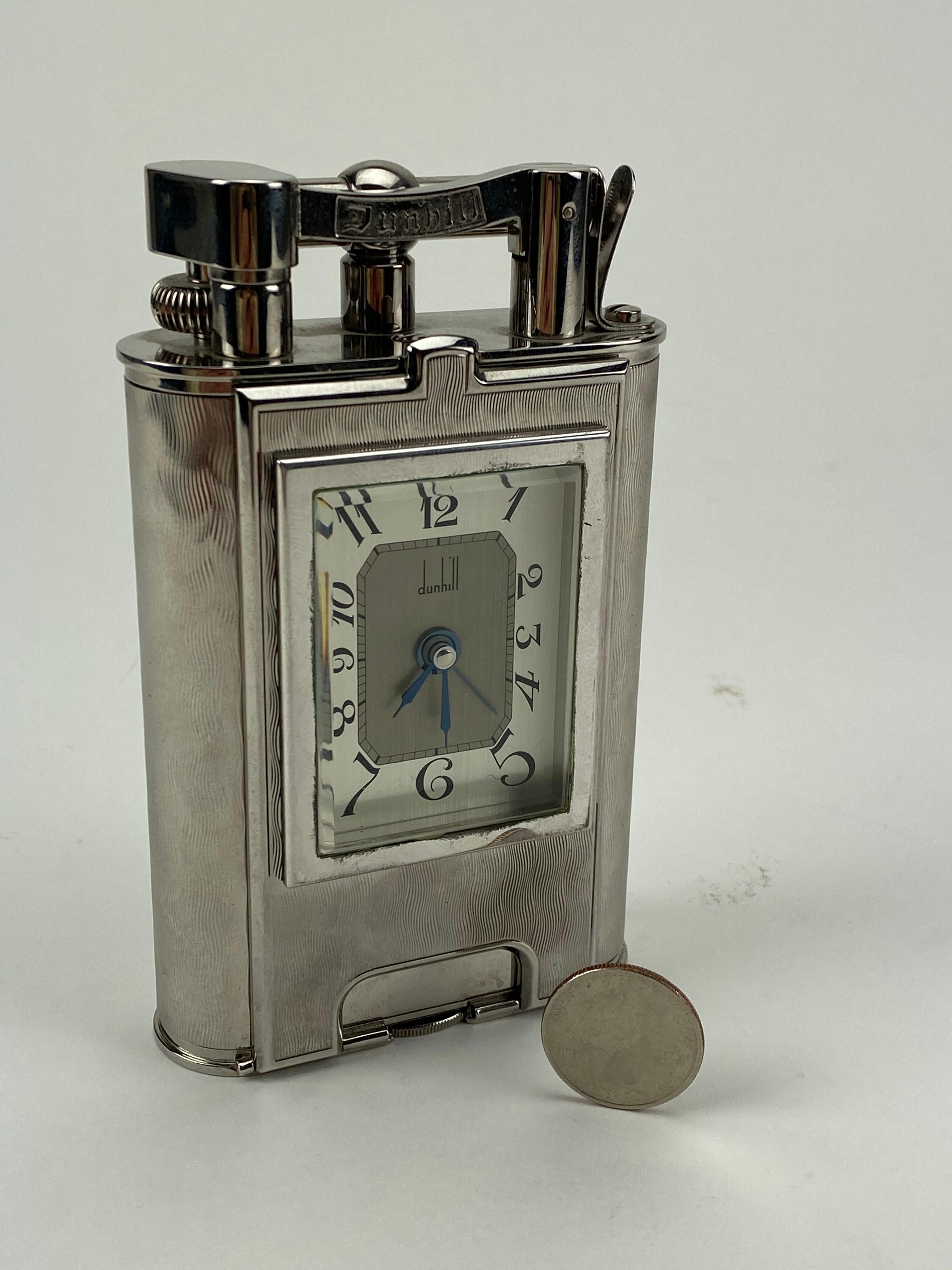 A very rare piece from Dunhill, limited to 200 pieces, this lighter/clock combination was made to honor some of Alfred Dunhill's original designs from the early 20th century. The scale and weight are truly incredible. Housed in it's original box. A