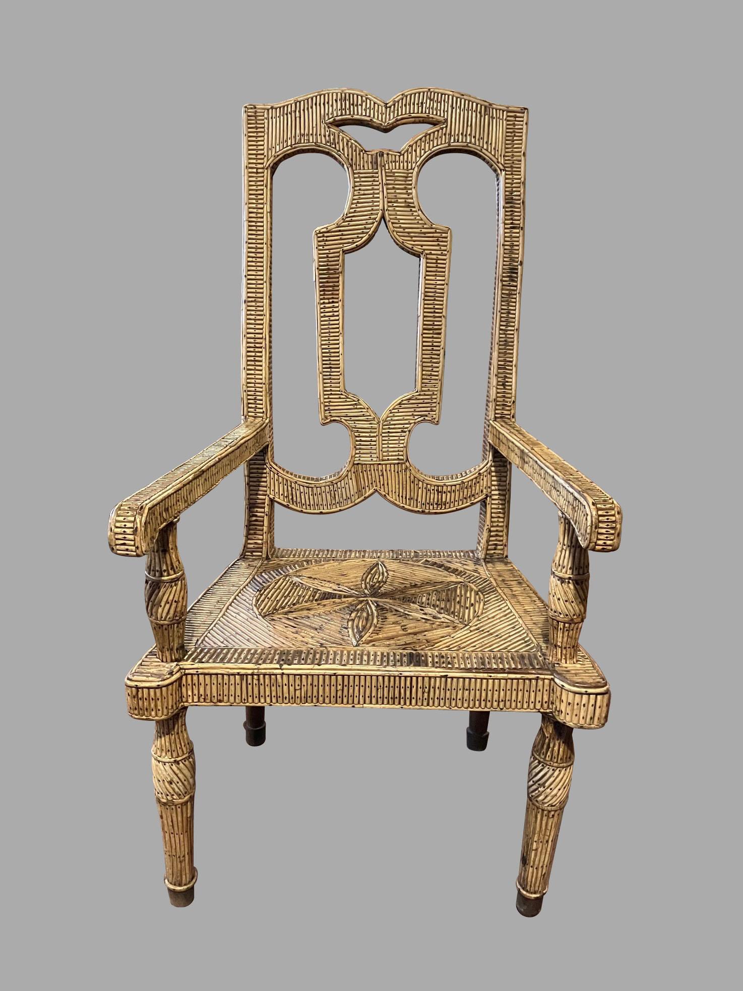 Rare fauteuil hollandais à haut dossier, avec une traverse en forme d'arc en croix au-dessus d'un dosseret percé, flanqué de montants rectilignes sur des accoudoirs à enroulement vers le bas. L'assise carrée est centrée par un motif floral stylisé