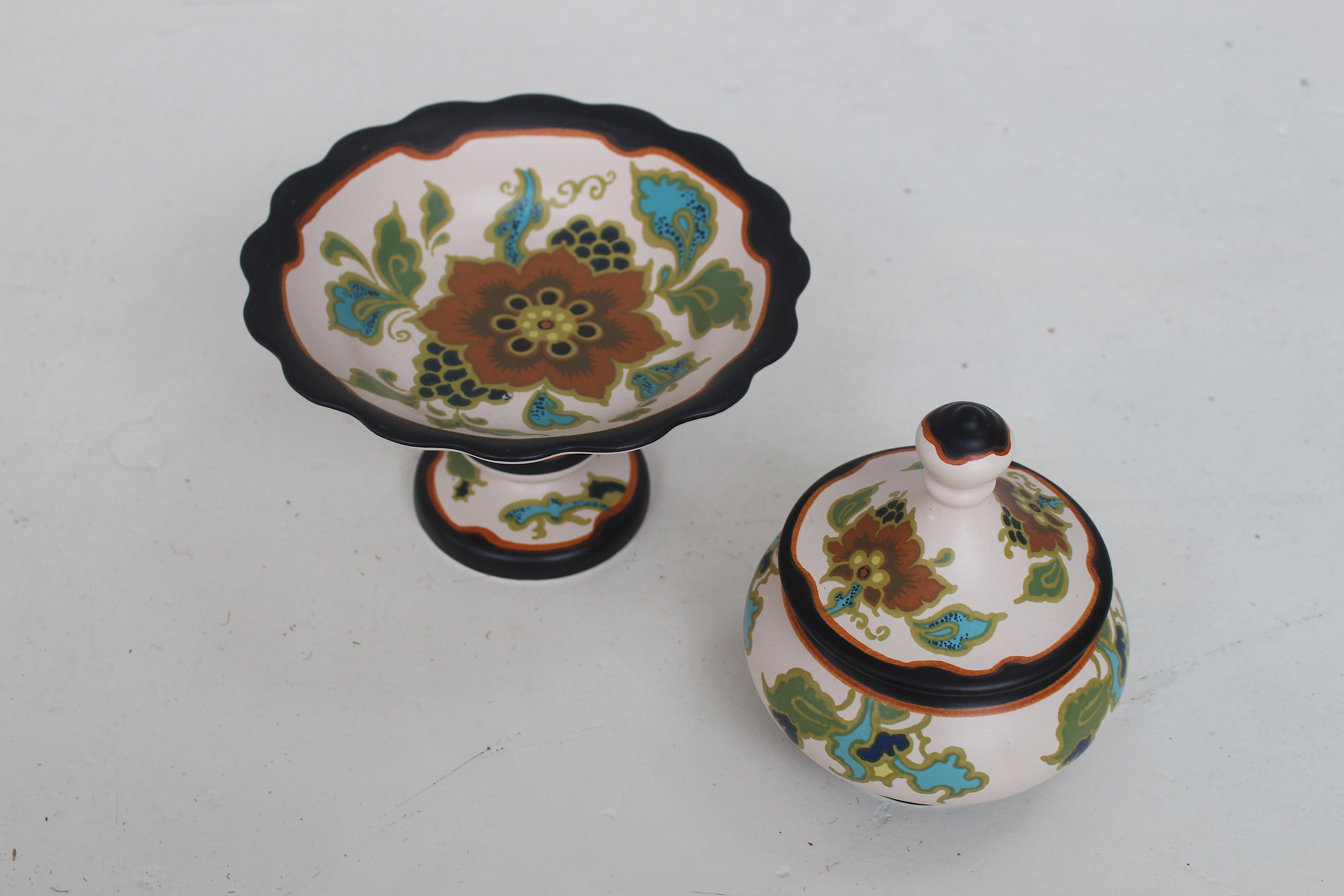 Beautiful set of Art Nouveau candy serving tableware.
This set was made by Plateel Pottery, Gouda Zuid-Holland, circa 1920s.

Hand painted original Dutch Art Nouveau ceramic art, the set is signed. (see image)
Both pieces are in an excellent