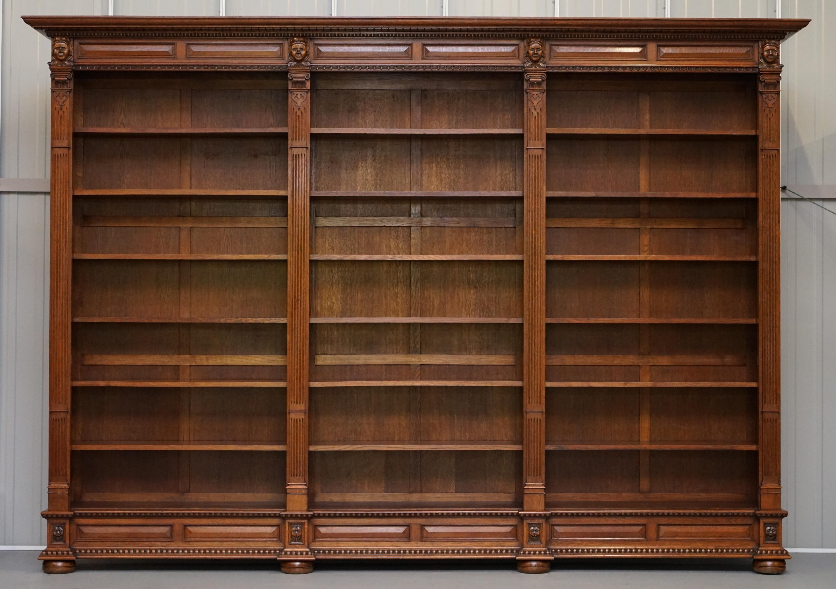 We are delighted to offer for sale this stunning hand carved solid oak Dutch triple bank Library bookcase circa 1940

This piece was hand made by a master craftsman in Bruges Belgium for a very successful Architect. Its part of a complete Library