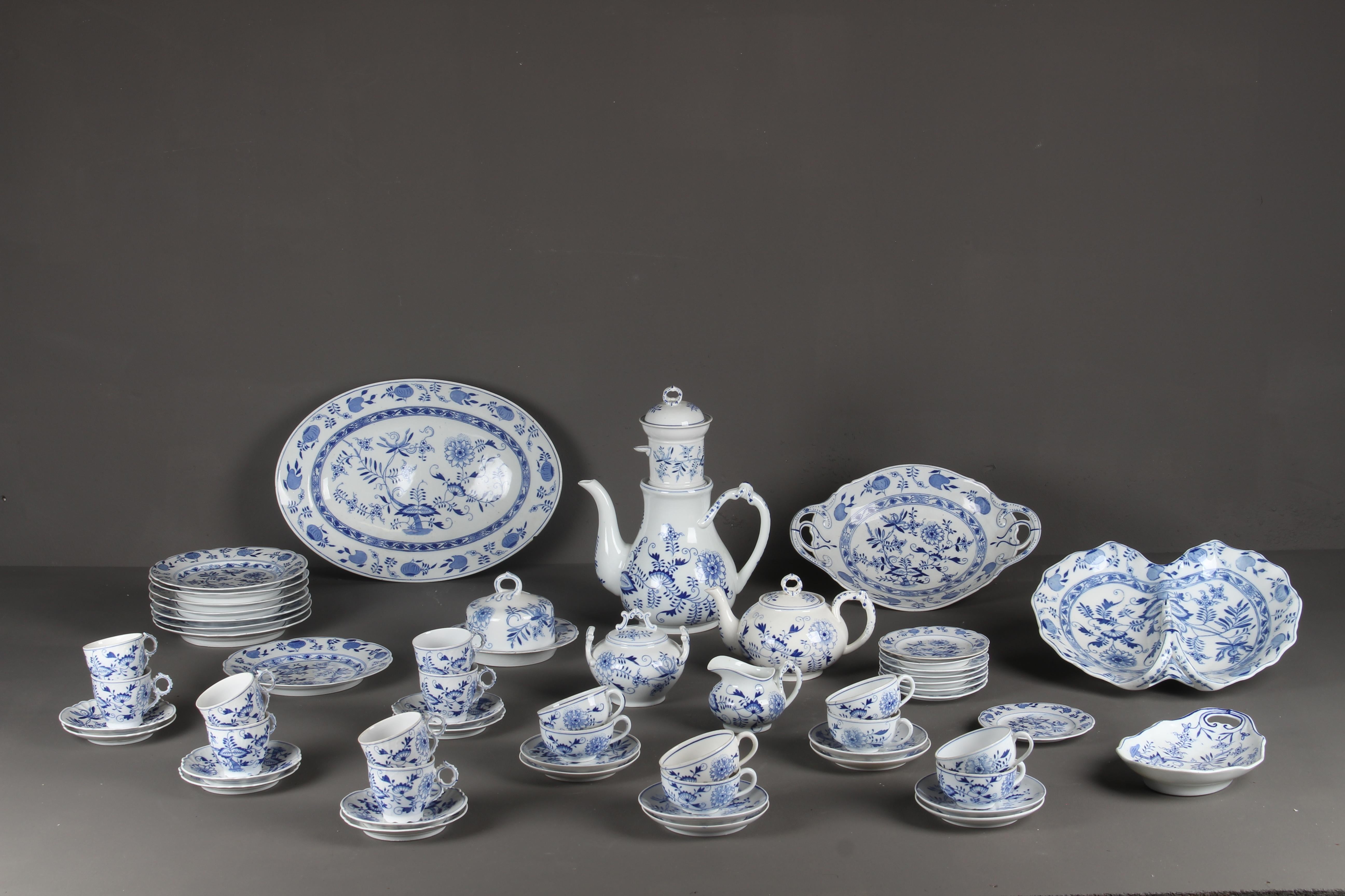 An extremely rare table service set by Louis Regout for Regout Porcelain Pottery Maastricht, 1890.
This 'Zwiebelmuster' motif was also used by Meissen in Germany. 
The city of Maastricht was and is a well-known cradle for ceramics, pottery and