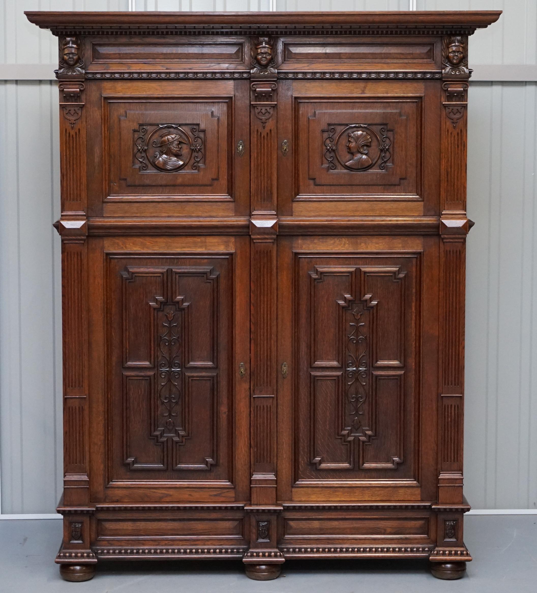 We are delighted to offer for sale this stunning hand carved solid paneled oak Dutch cupboard circa 1940s

This piece was hand made by a master craftsman in Bruges Belgium for a very successful Architect. Its part of a complete Library suite which