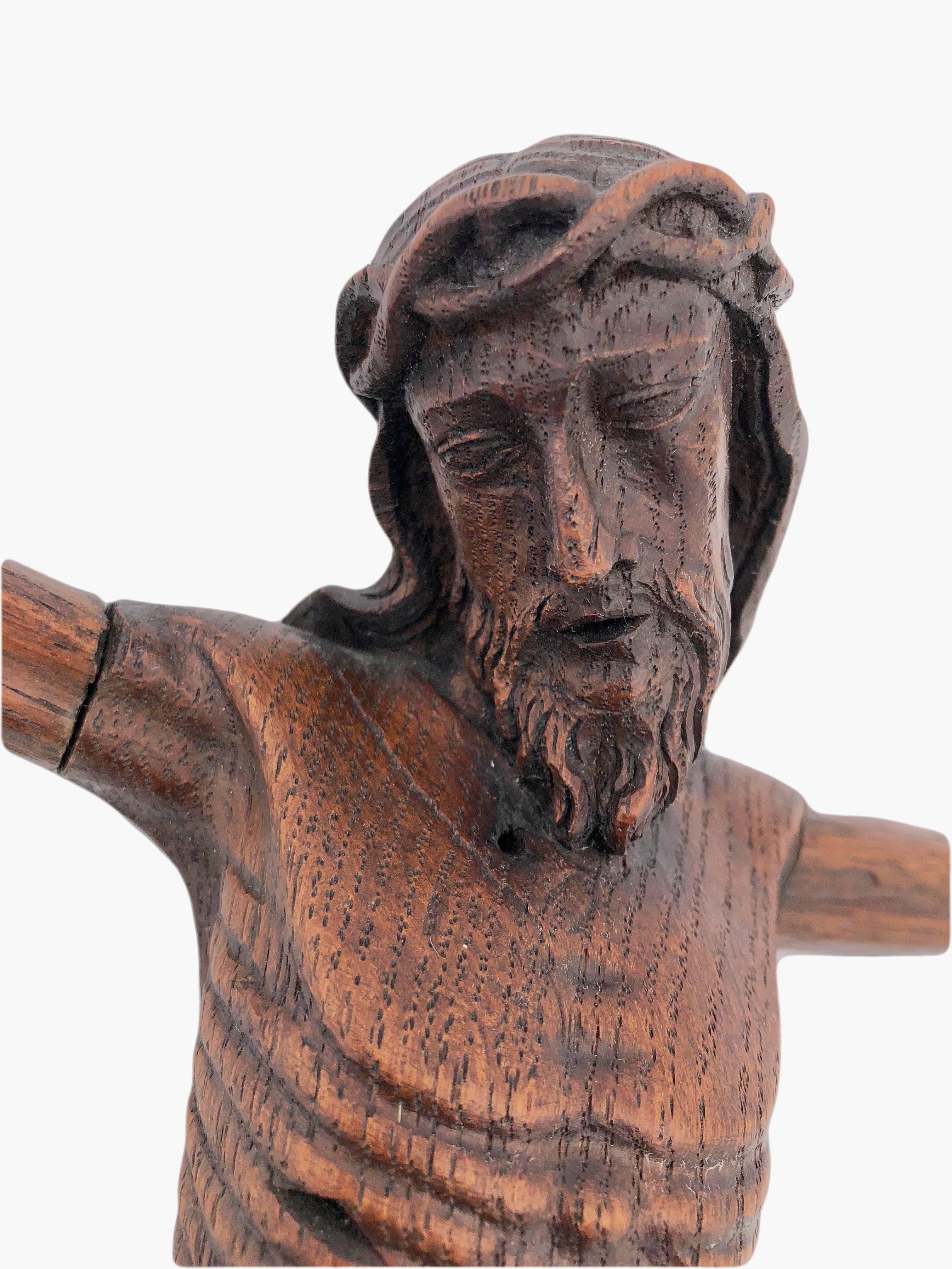 This is a rare early 1800s stunningly hand carved French wooden Christ. The detail and artistry are amazing. The hands have 2 fingers outstretched and two folded which may apply to the Orthodox religion since believers make the sign of the cross