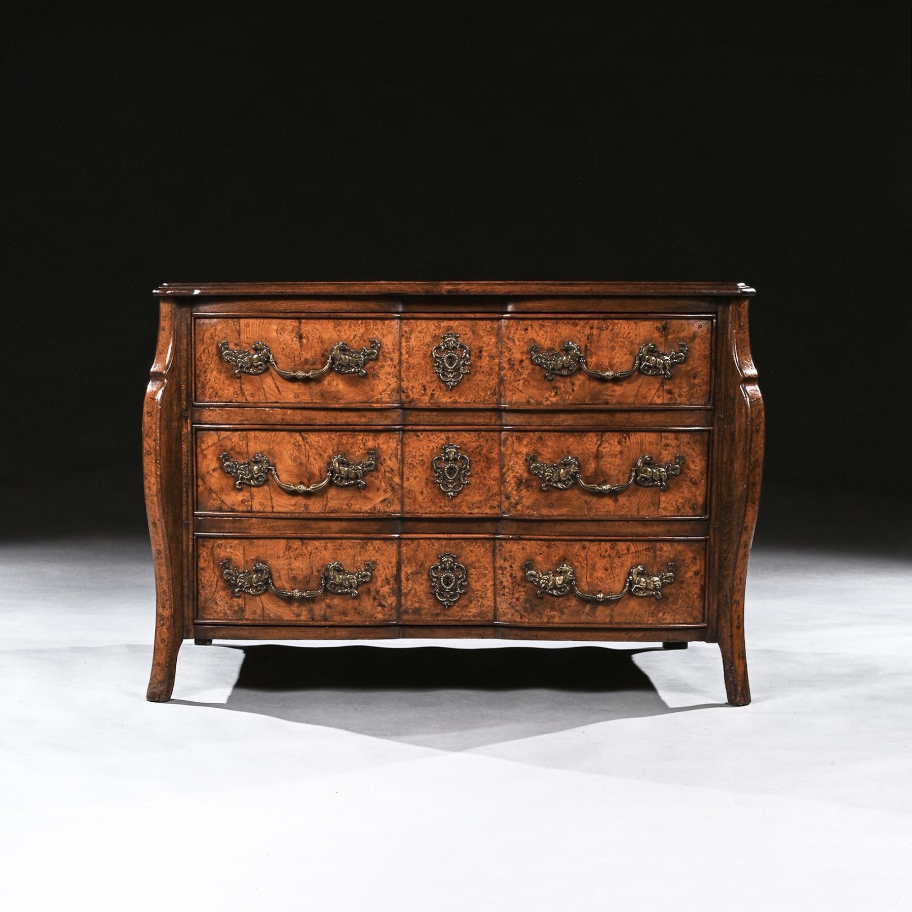 A rare early 18th Century Louis XV provincial burr elm shaped front mazarin commode of excellent colour and proportions.



French Circa 1710.



Constructed with thick cuts of tight burr elm dowelled to the carcass, the rectangular burr elm