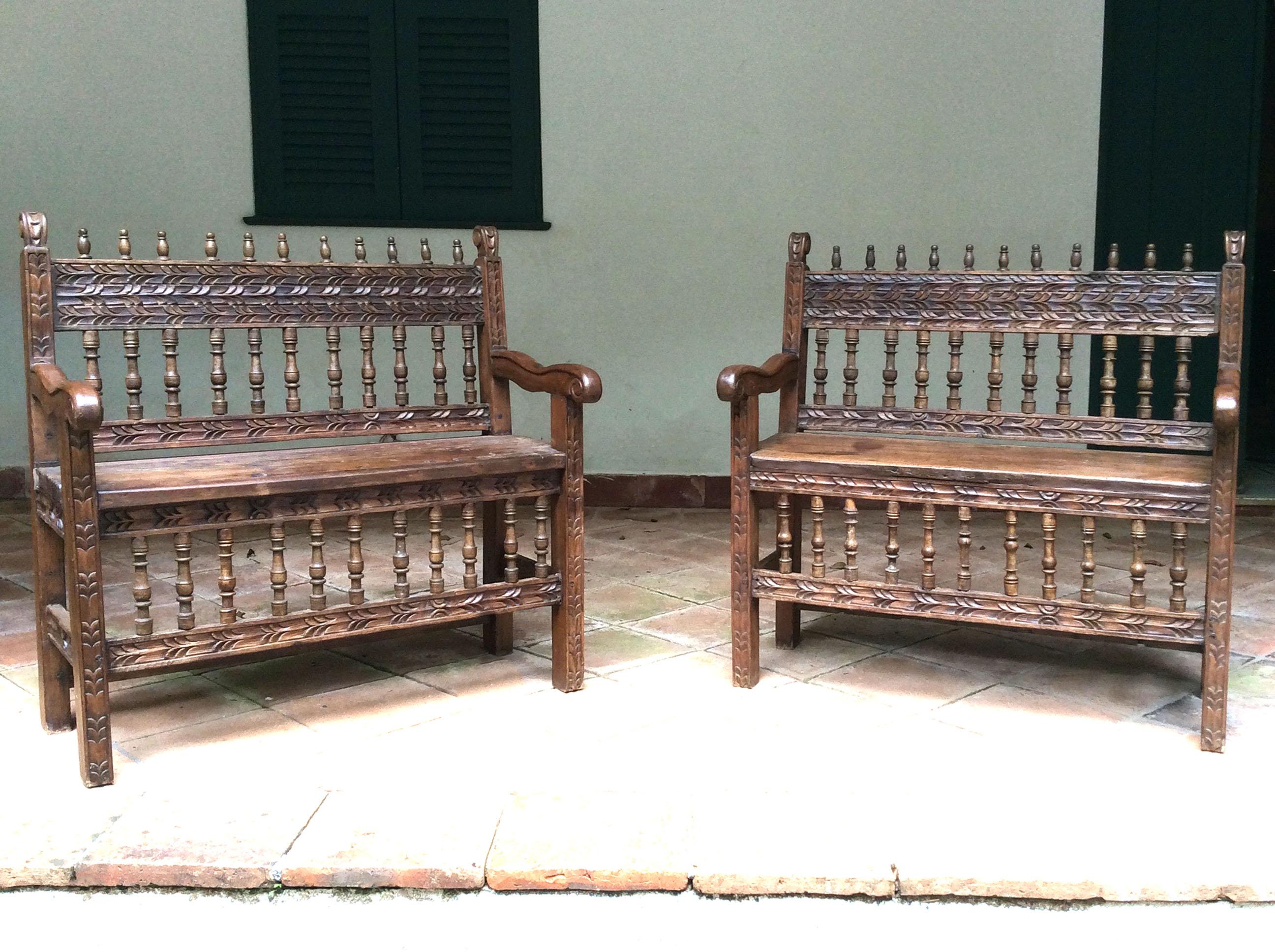 This remarkable pair of early 18th-century Spanish Colonial benches exudes historical charm and exquisite craftsmanship, making them a rare find for collectors and enthusiasts of antique furniture. Originating from the Spanish colonies, these