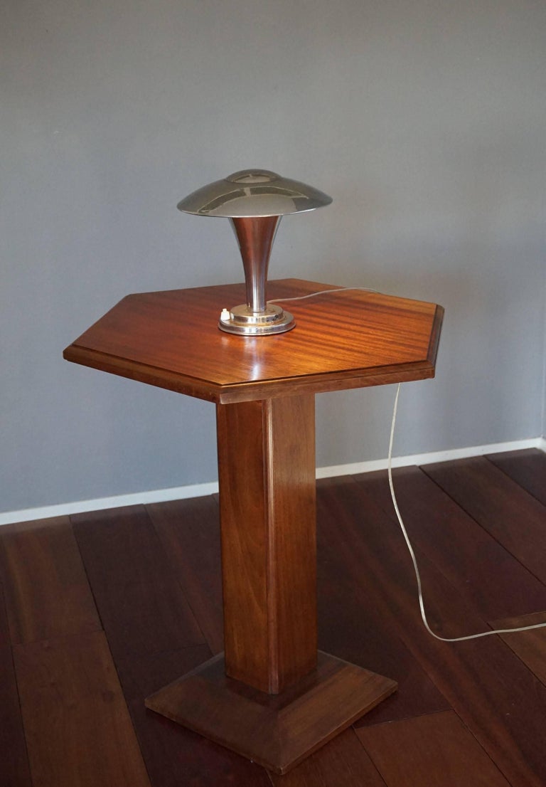 Incredibly stylish little Art Deco desk lamp.

There is something about this little Art Deco and Bauhaus style table lamp that makes me feel that it could very well be by one of the greatest designers from the early 20th century. To us the design is
