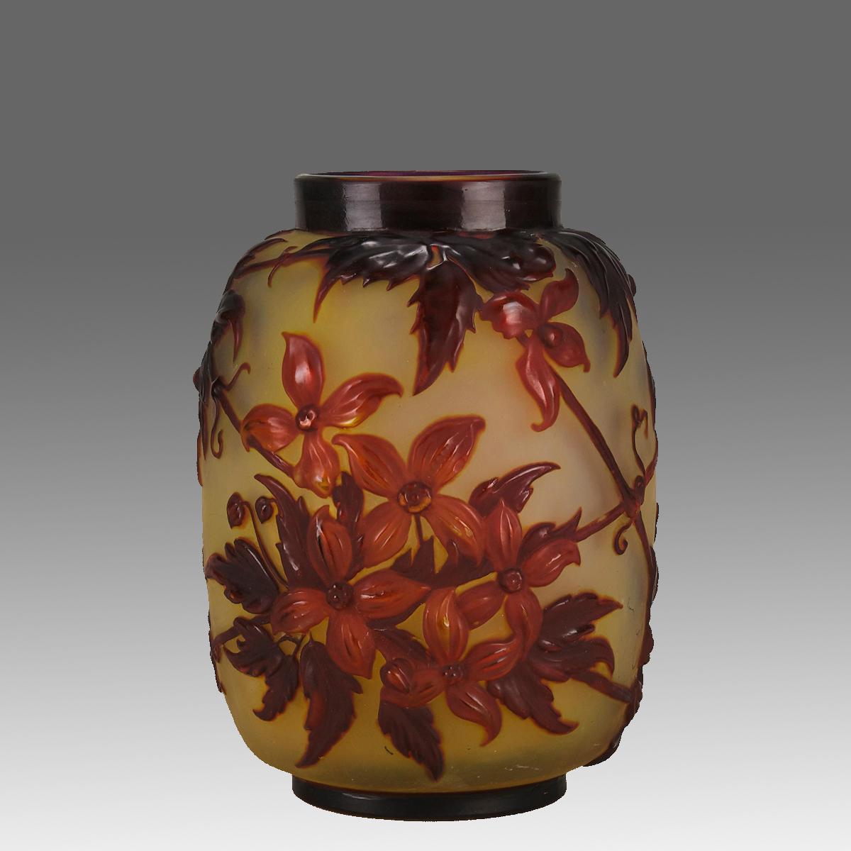 An eye catching and rare early 20th Century French cameo glass vase with a decorative mould blown design of flowering clematis in orange and red colours against a deep yellow field, signed Gallé.

ADDITIONAL INFORMATION
Height:                      