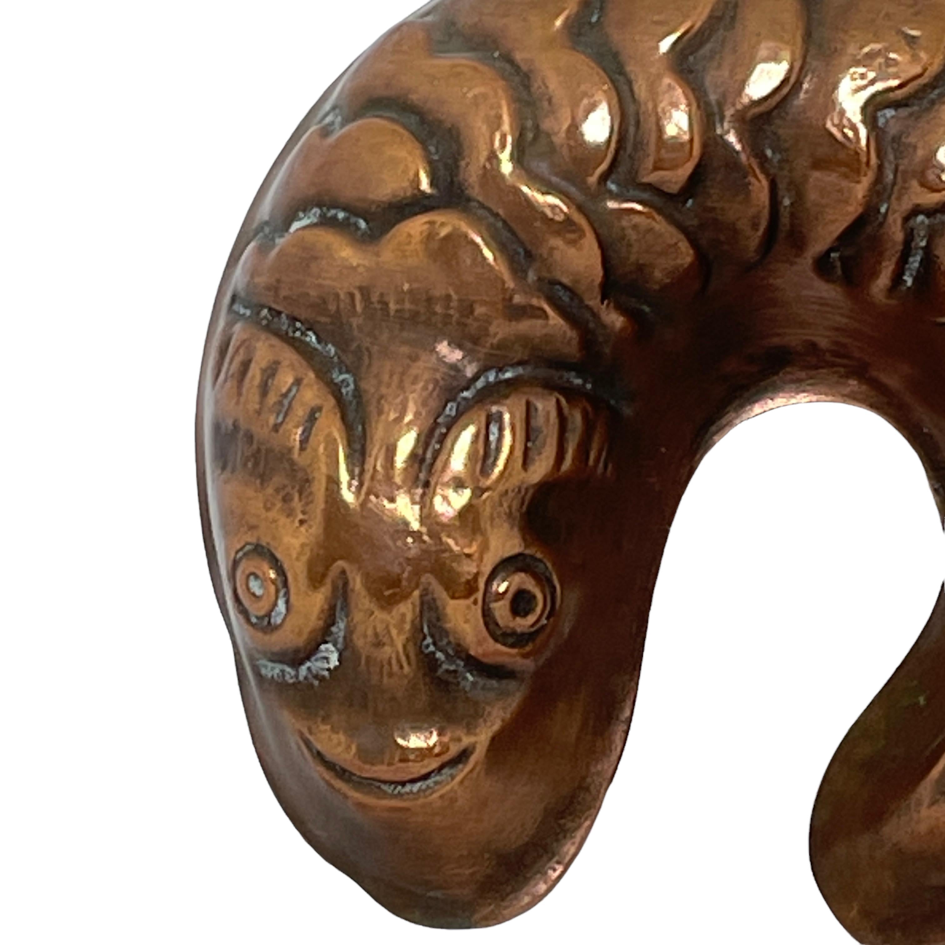 A antique copper cake baking mold in a nice cute design. This german cake mold was found at an Estate Sale in Nuremberg, Germany. The pan has been lightly polished and shows its natural patina on the copper exterior. Also may be used as a wall