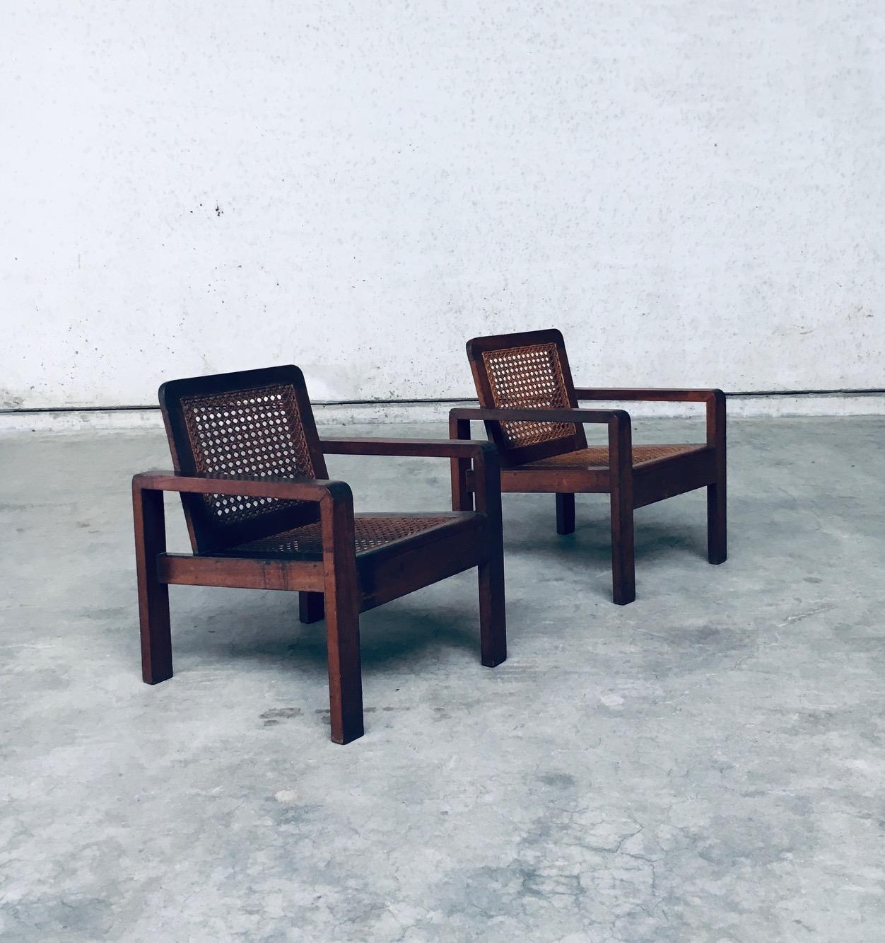 RARE Early 20th Century Design small Lounge Chair set of 2. Made in France, 1910 - 1920's period. The design is in the manner of Pierre Jeanneret or Francis Jourdain style lounge chairs. Solid hardwood construction with cane webbing seat and back.