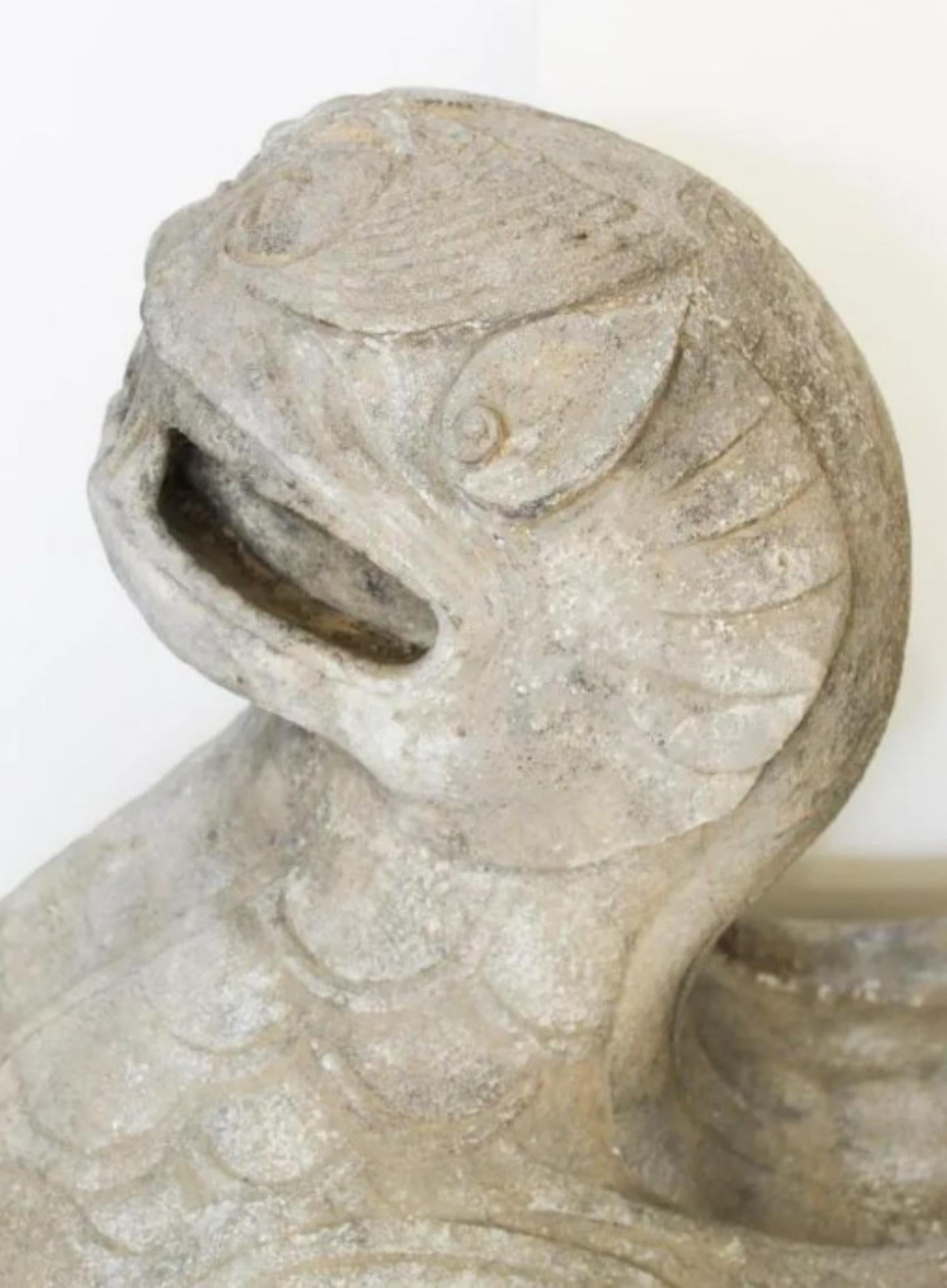 Rare Early Chinese Limestone Tomb Guardian-Tianlu. Late Han through Liang Dynasty, 200 BCE – 550 CE. The offered large scale stone carving is one of a number of mythical stylized lion-like winged guardians known as either Tianlu, (heavenly