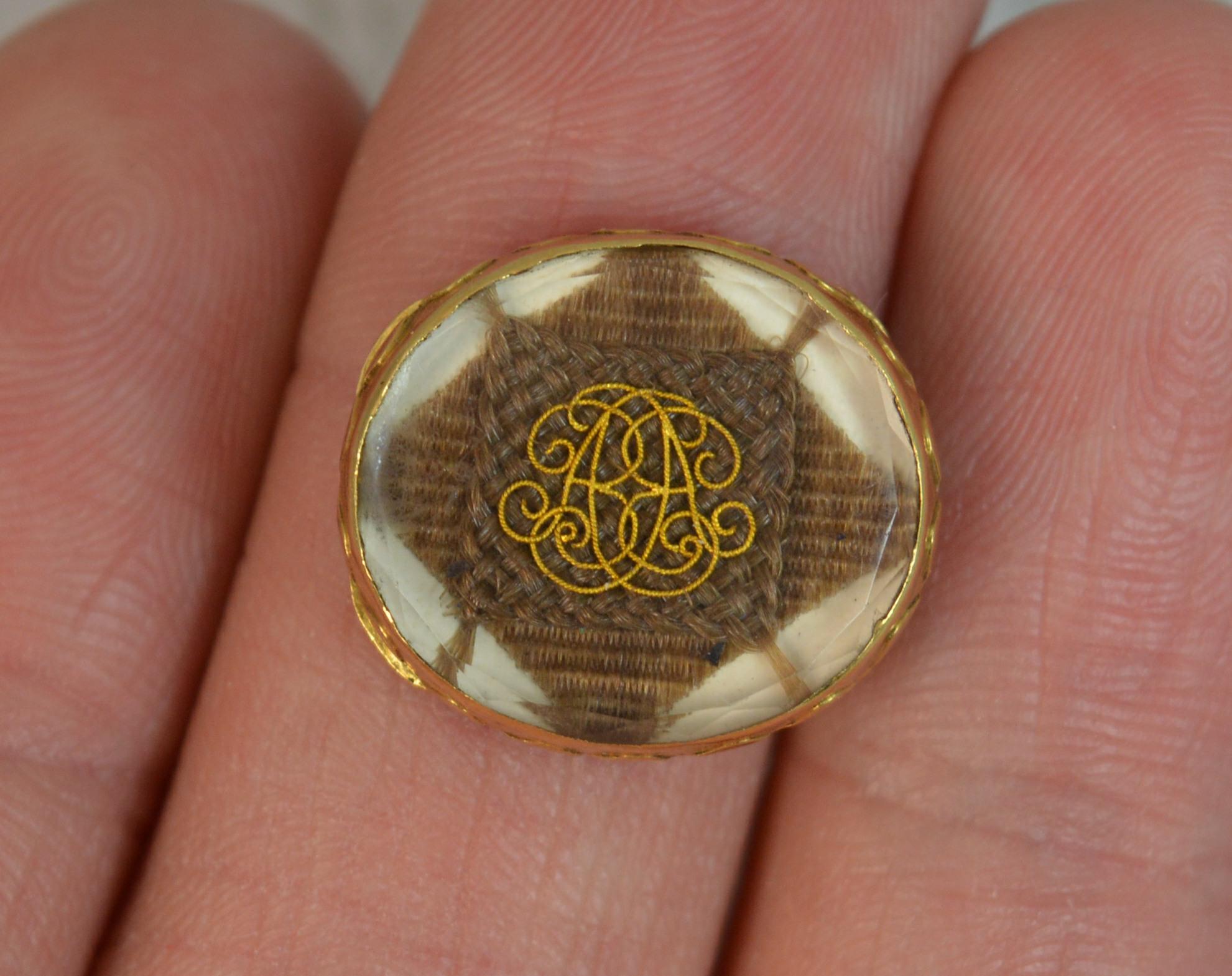A stunning true early Georgian era Stuart Crystal mourning slider.
Original order in 15 carat yellow gold. Slider bars and plain reverse. The front houses what looks to be AA initials over braided hair.
The mystique of the crystals is embedded in