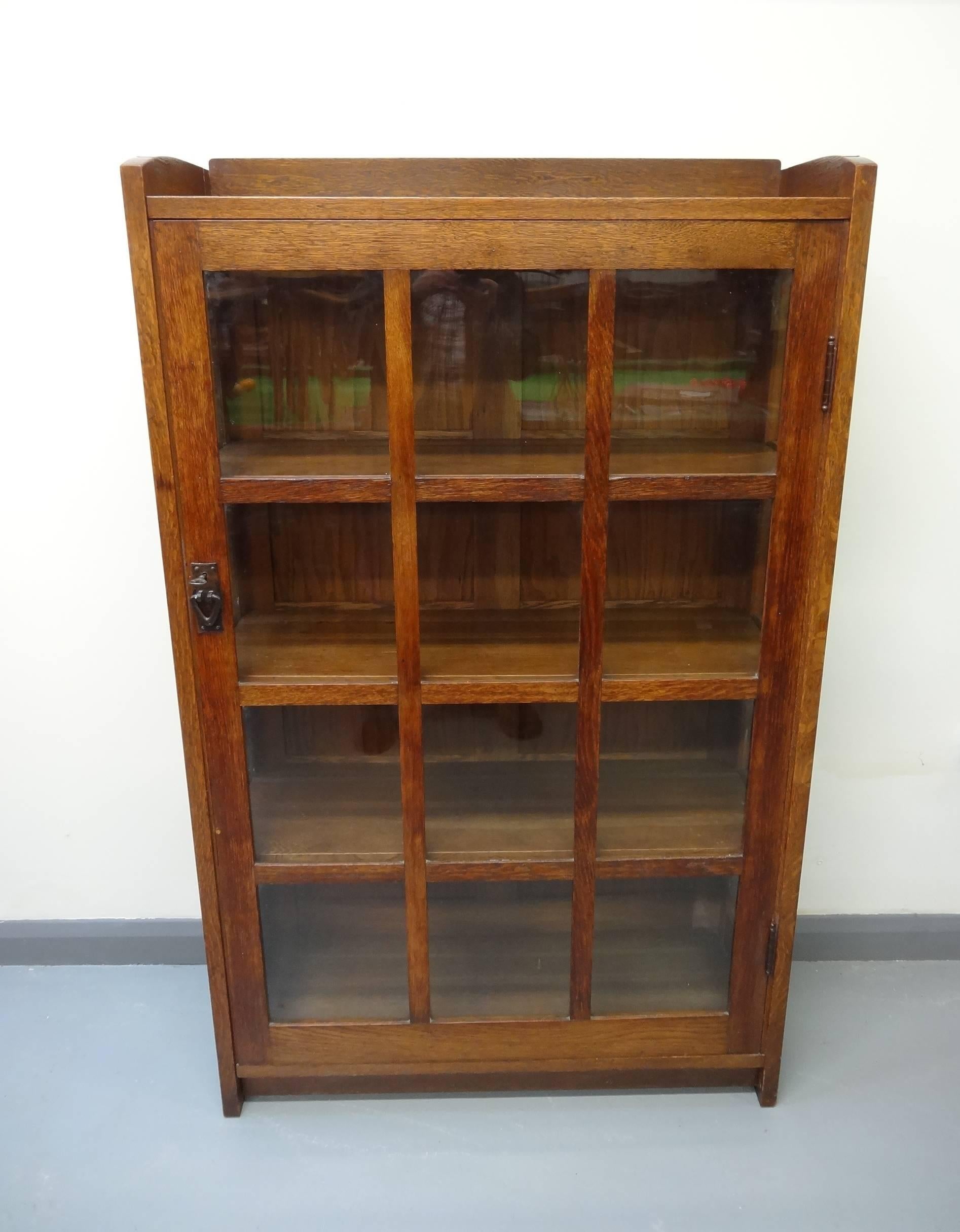 Superb American Arts & Crafts/Mission oak glazed china bookcase cabinet by the master, Gustav Stickley, circa 1903.

Original label to back. Plus its lovely original key. 
Although normally categorised as a china cabinet, the label (not very
