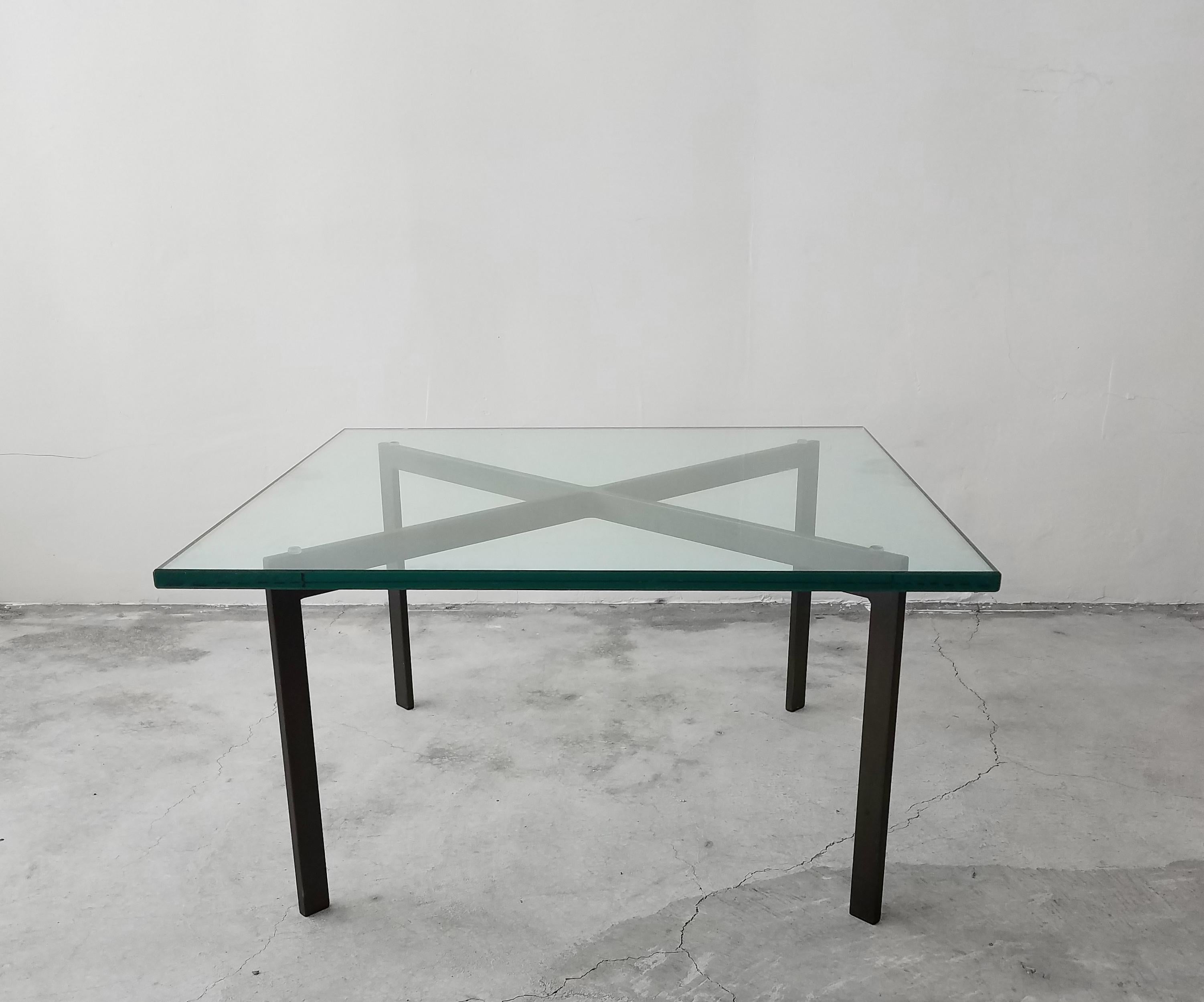 Early version of a Classic midcentury Barcelona coffee table by Mies Van Der Rohe for Knoll. There is a sea of chrome Barcelona tables but to have one in in Bronze is a rare find. Such a simple, yet modern and elegant piece. A Minimalist bronze