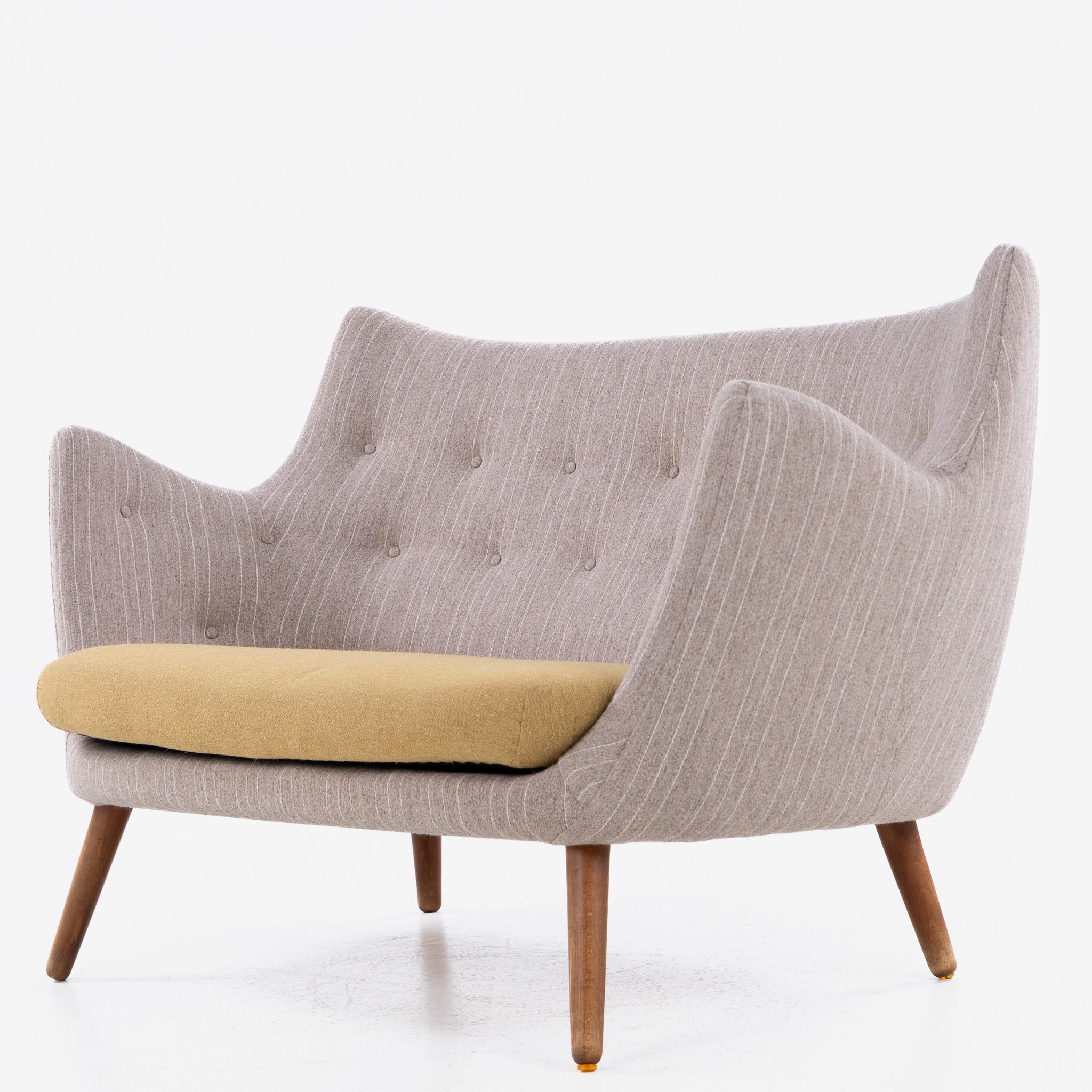 Rare and early version of the ‘Poet’ sofa in new textiles (Samsø and Siksak textiles respectively) with legs in patinated beech.

Designed in 1941 and exhibited the same year at the Cabinetmakers' Guild Exhibition. The sofa was originally designed