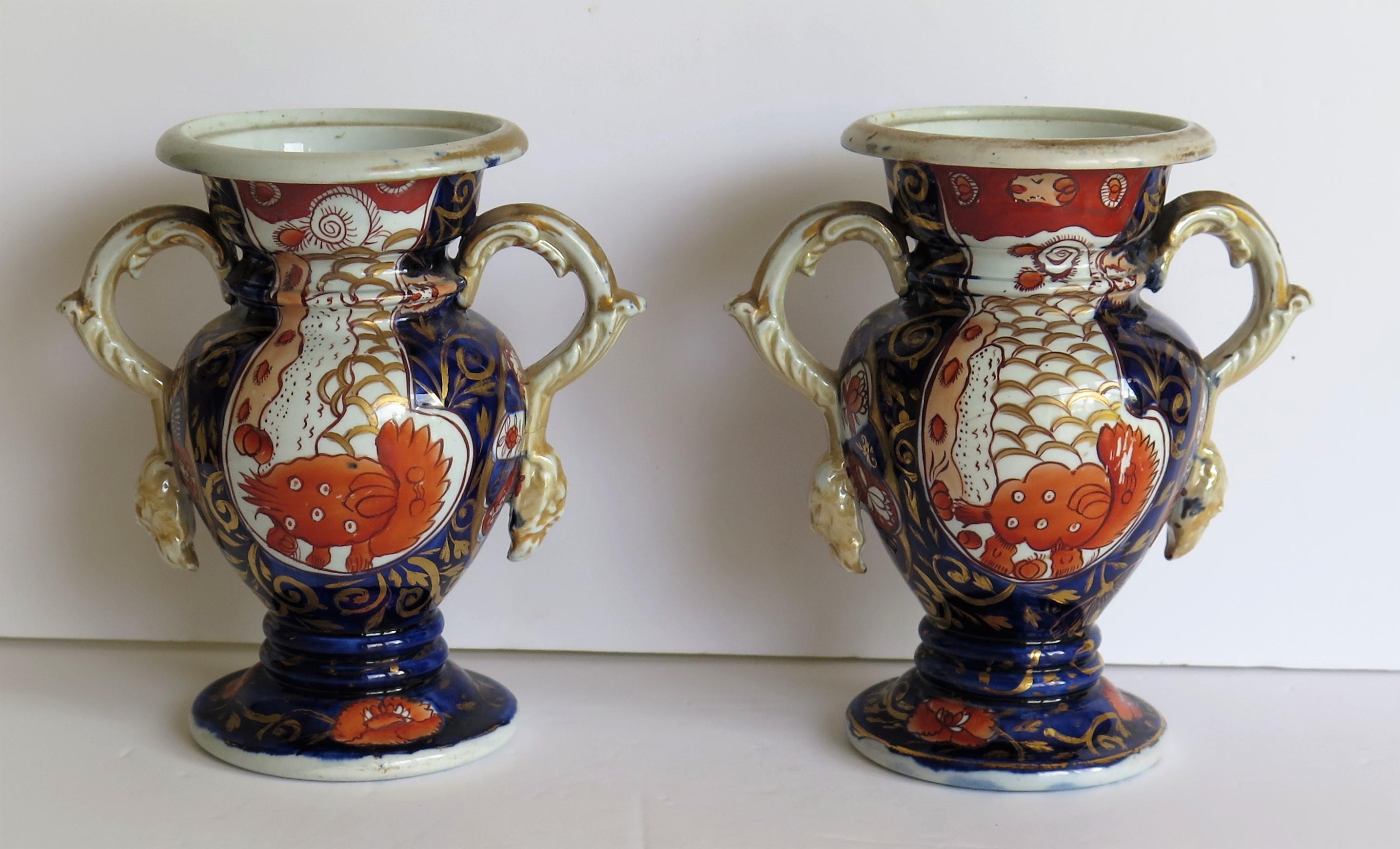This is a rare pair of very decorative Vases in the Elephant's Foot pattern, made by Mason's Ironstone, of Lane Delph, Staffordshire, England, in the early 19th century, circa 1820

The vases have a baluster shape raised on a circular ring knopped
