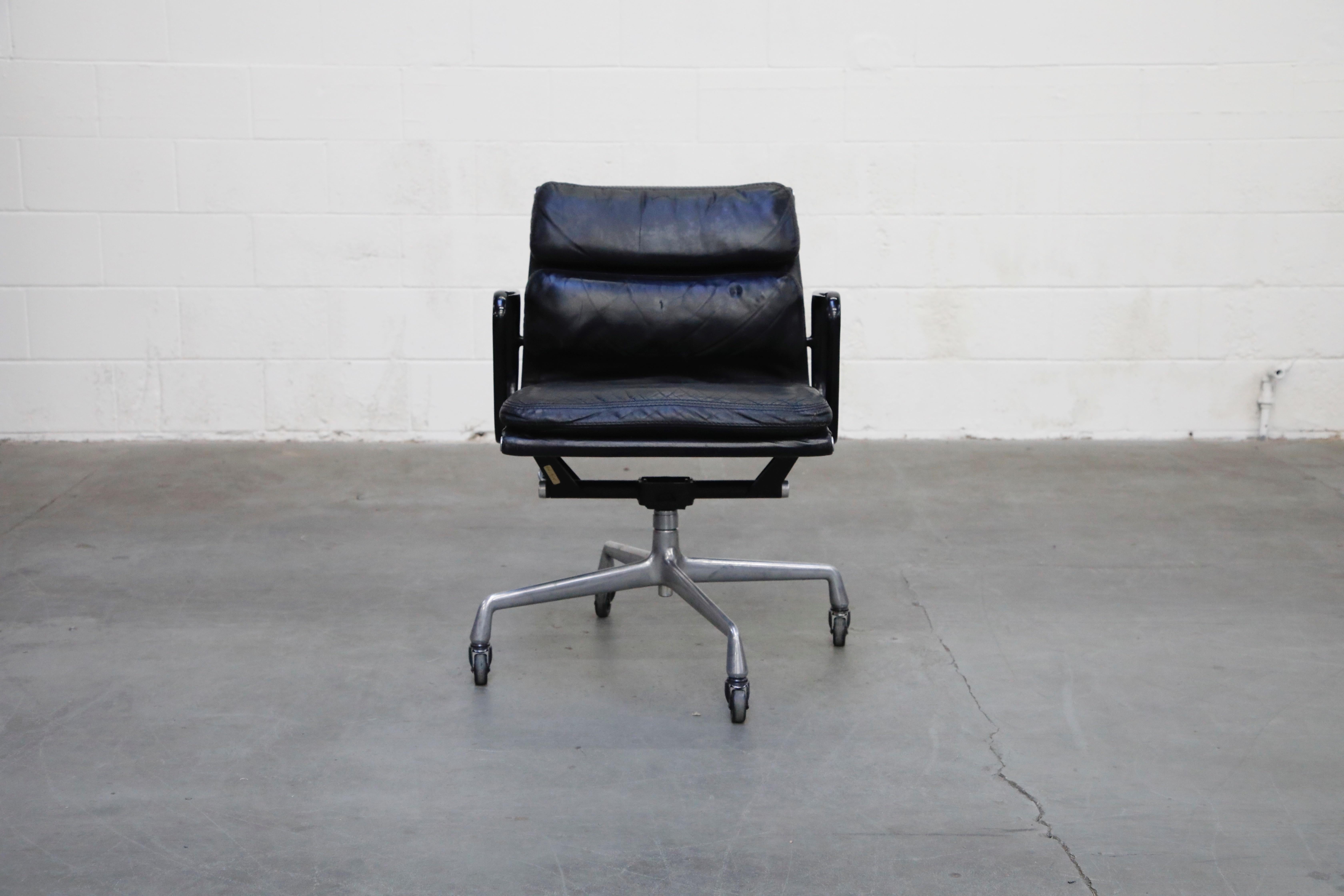 A rare early production year signed and dated collectors example of a rare colorway, black leather on black frame with aluminum base 'Soft Pad' Management Chair, dated February 3, 1976 - the same great year that brought us 'Rocky', 'King Kong', and