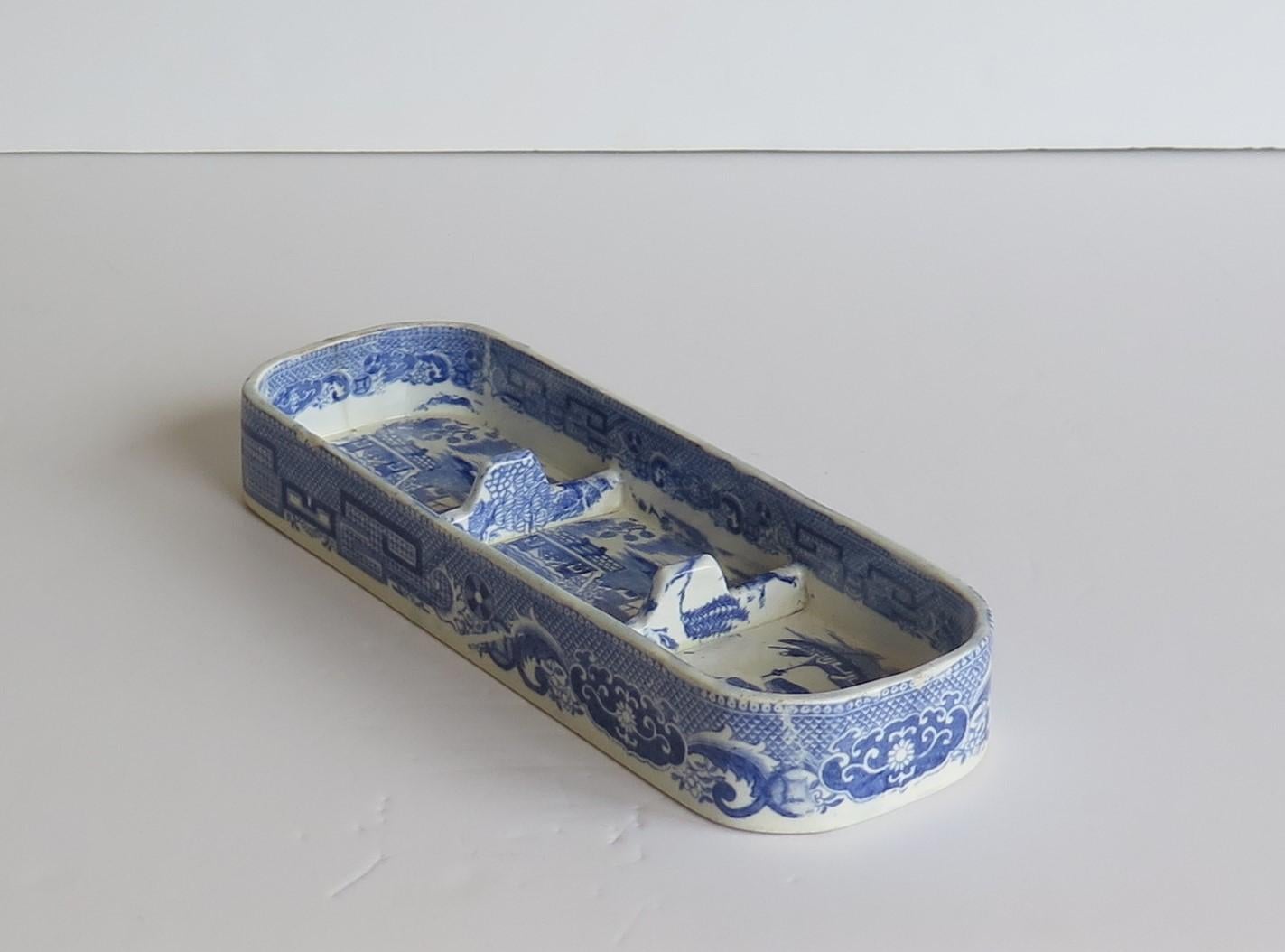 This is a rare Pearlware pottery pen tray decorated in a printed Blue and White willow pattern, produced by the Josiah Spode factory, Stoke on Trent, England, made in the later years of the 18th century, circa 1790-1800.

The tray is potted in