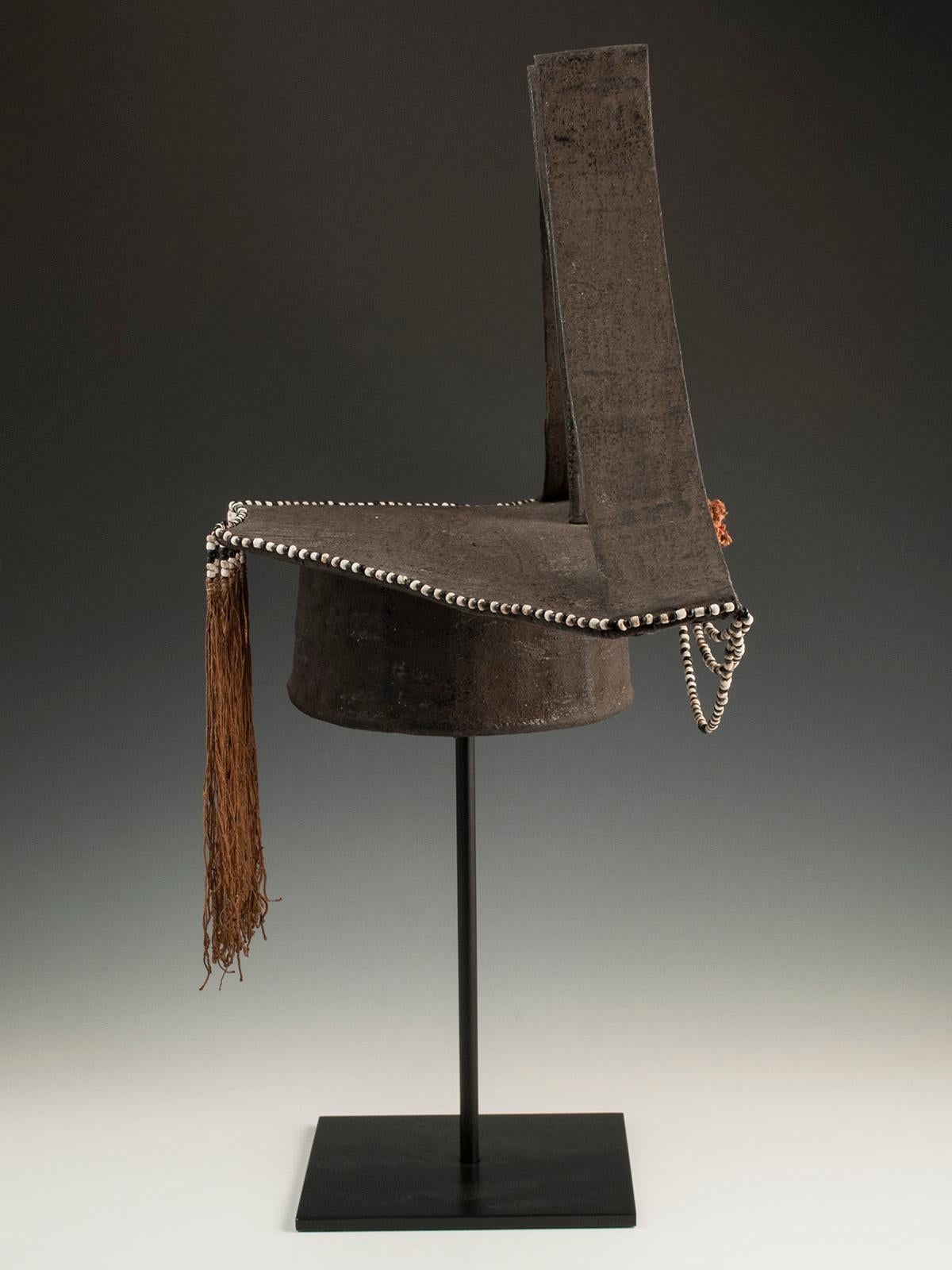 Rare early-mid-20th century tribal woman's wedding hat, China.

This is an unusual woman's wedding hat with dramatic upswept peaked elements from the Pan/Yao people, Kontszyan District, Guizhou Province, China. An orange silk pompom anchors three
