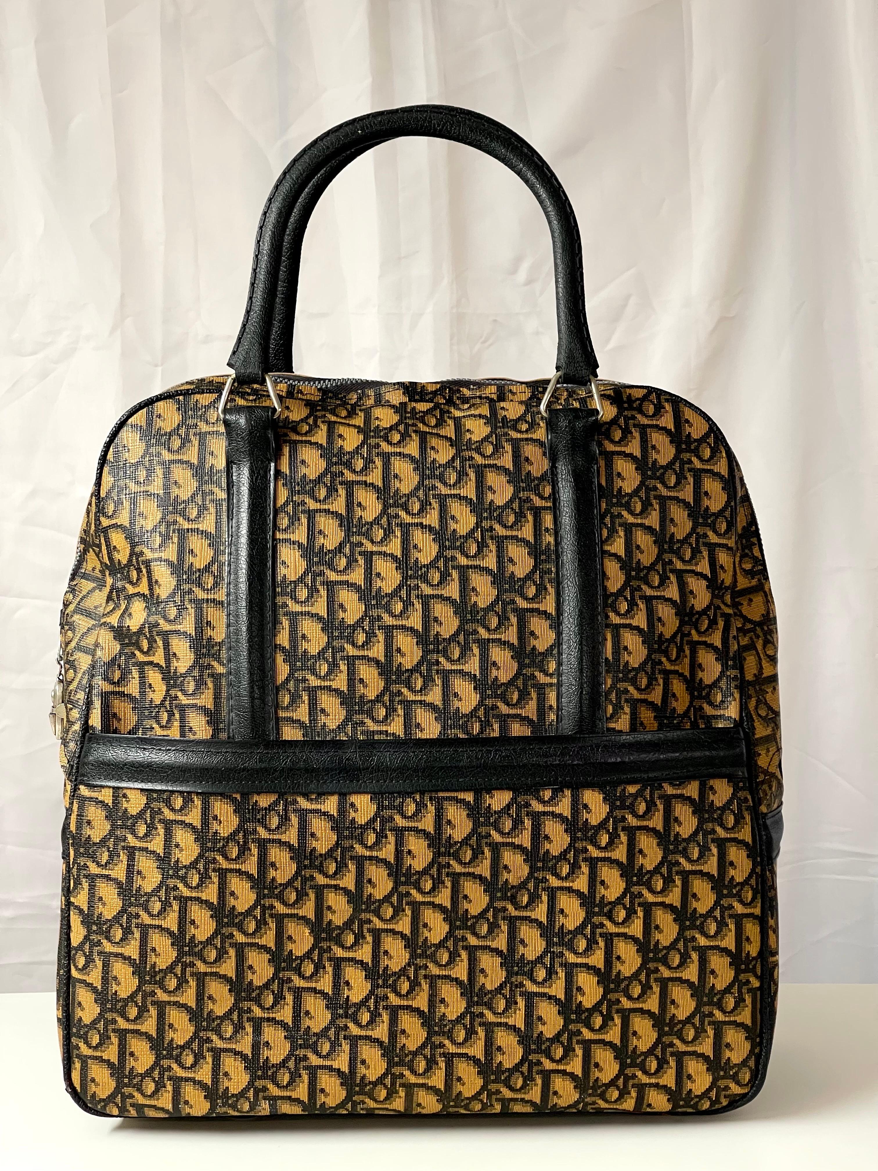 Rare Early Christian Dior Monogrammed Bowling Bag. Iconic design with the classic trotter pattern. Large round oversized bag with designer label plates. Original condition. No repairs. 
Interior Christian Dior name throughout interior fabric. See
