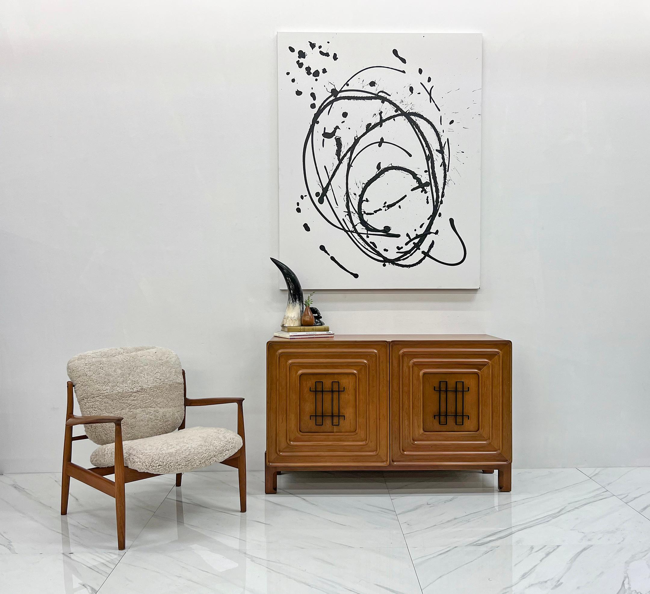 This is an extraordinary credenza/cabinet, masterfully designed by renowned Swedish designer Edmond Spence. This exquisite piece showcases Spence's exceptional talent and reflects his unique approach to furniture design.

Crafted for Industria