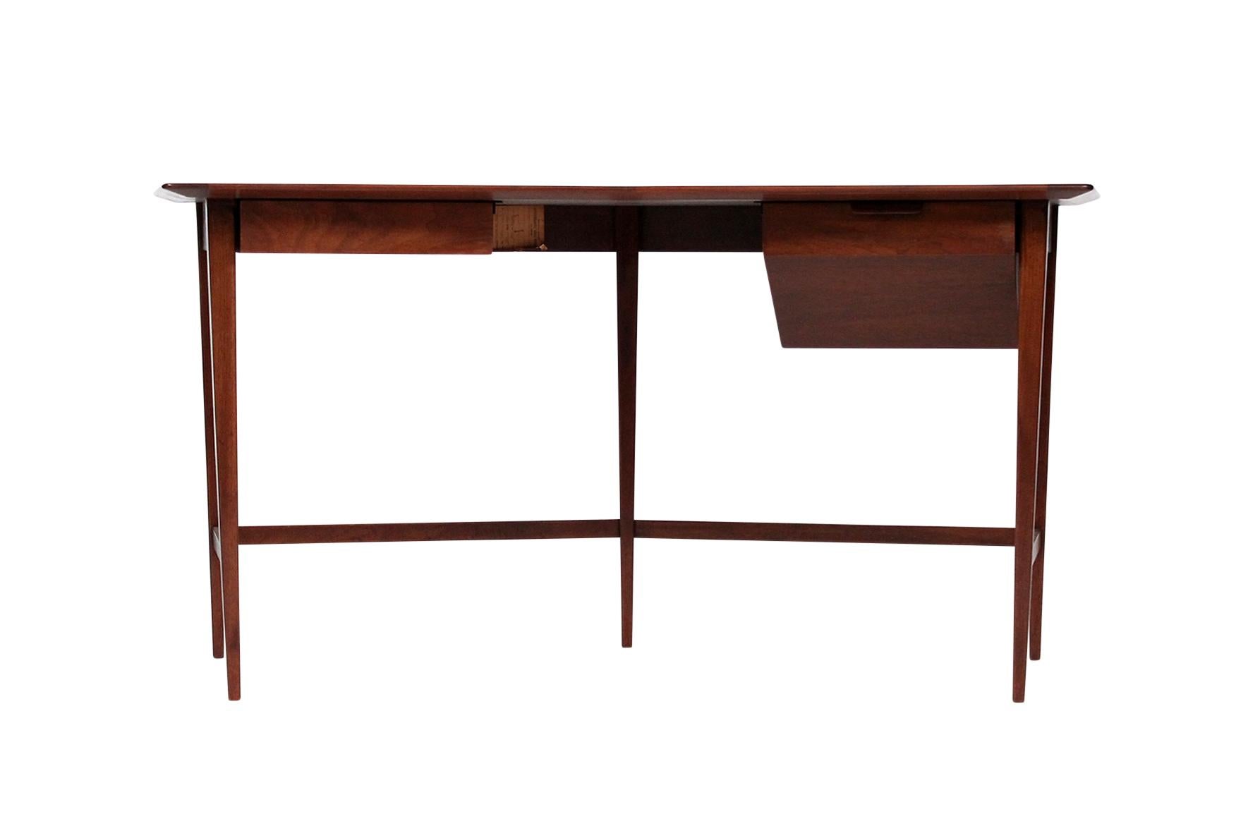Rarely seen and delicately designed Edward Wormley for Dunbar desk in walnut.
