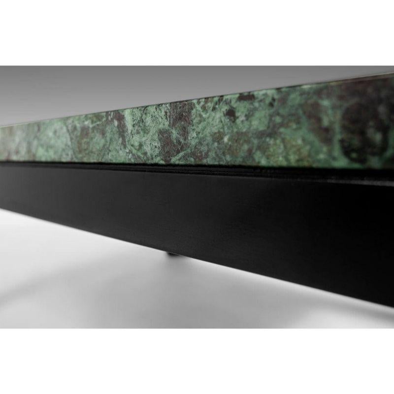 The quintessential cocktail table by Edward Wormley for Dunbar. A green marble top resting on an ebony black base. Table retains the original Dunbar maker's mark.



