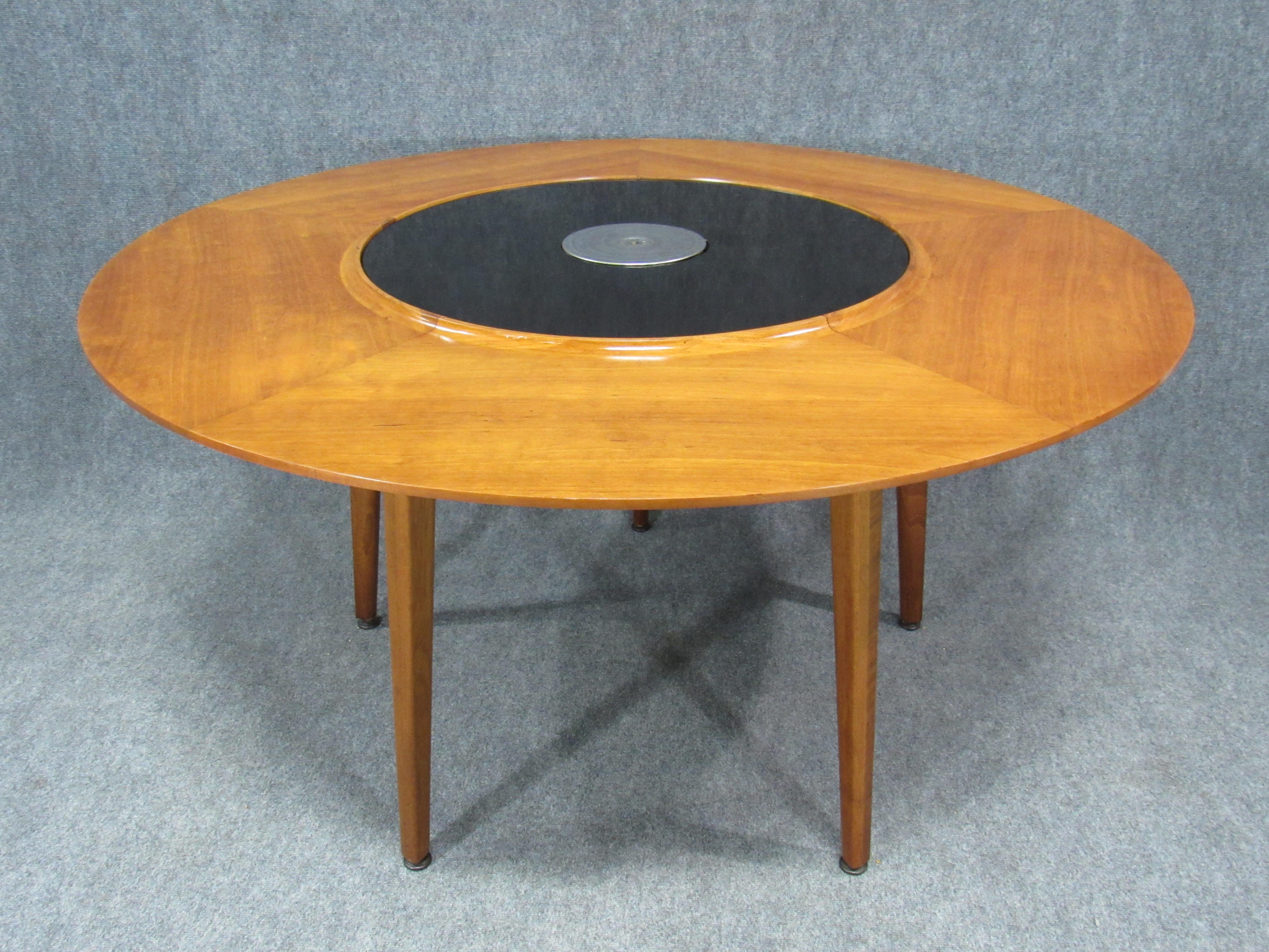 Lazy Susan dining table with interchangeable laminate spinning top. Warming unit in the middle of the top still functional. Great for fondue parties.
Signed with branded Dunbar.