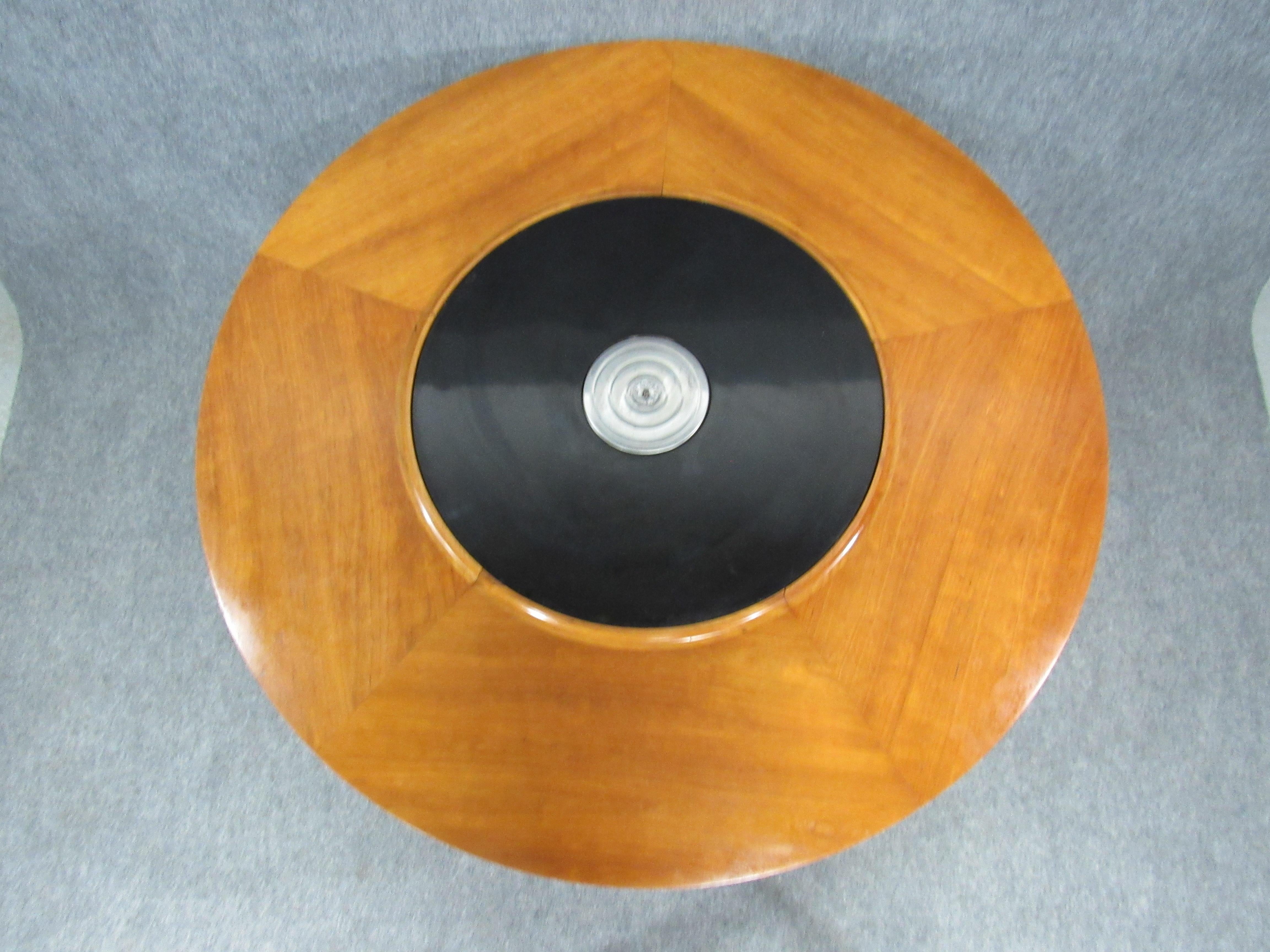 Lazy Susan dining table with interchangeable laminate spinning top. Warming unit in the middle of the top still functional. Great for fondue parties.
Signed with branded Dunbar.