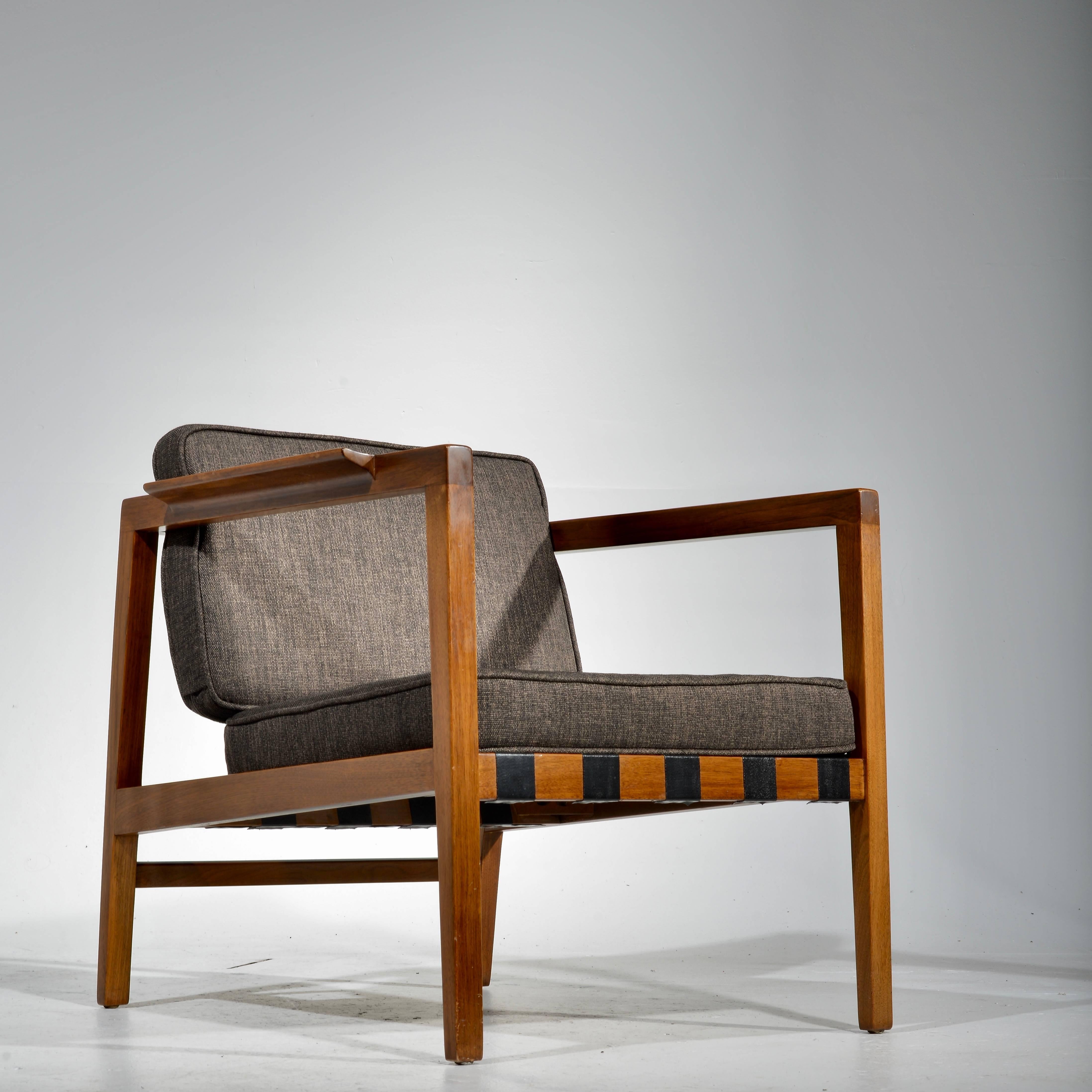 This is an early and rare architectural open armed lounge chair in walnut by Edward Wormley for Dunbar. We are showing it with stock cushions, custom upholstery is available.
 