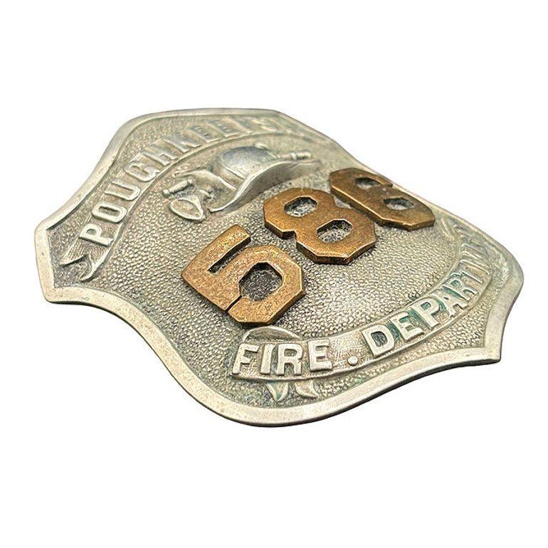 Rare Turn of the century Edwardian era Poughkeepsie, NY Fire Department Badge in Dutchess County. This shield-shaped white metal badge belonged to a firefighter from Poughkeepsie, New York, and features the raised number “257” beneath a fire helmet,