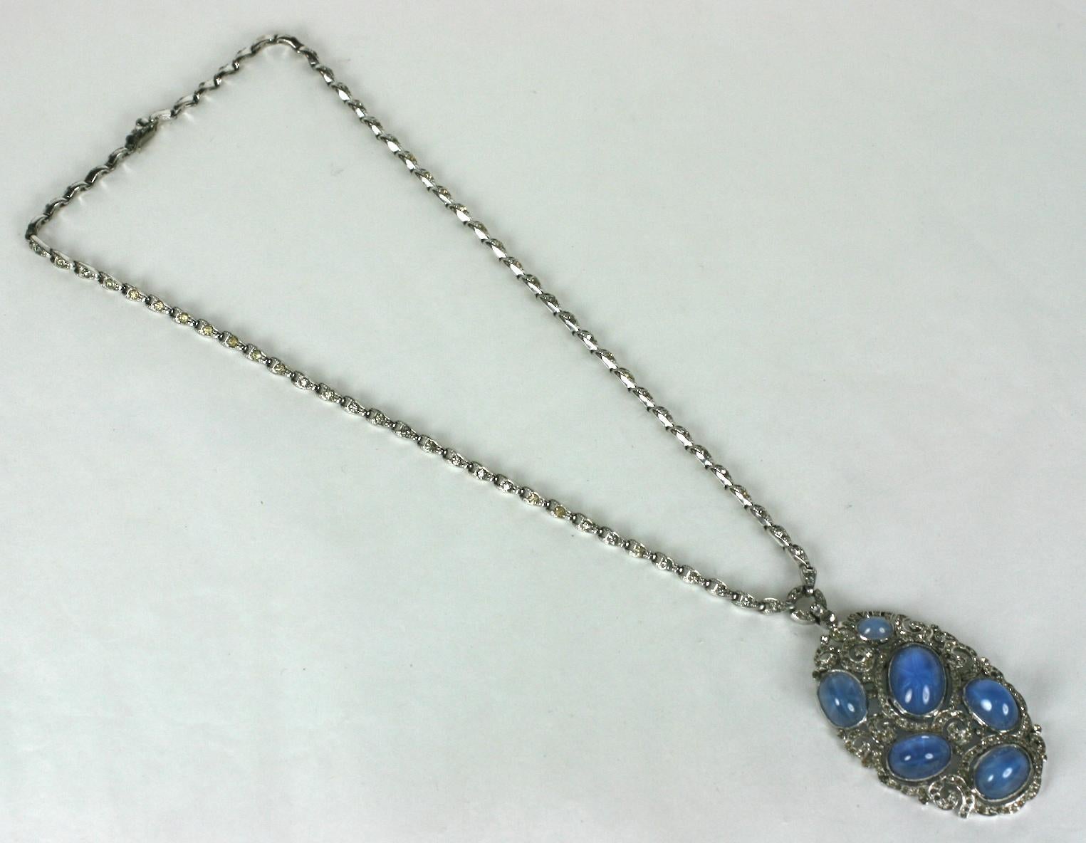 Rare, early Edwardian Style Early TFK Trifari Art Deco Necklace Star Sapphire glass cabochons. Pave links suspend an oval drop set with six faux star sapphires and pierced pave work.Rhodium plate base metal, set with  crystal   rhinestones
Signed