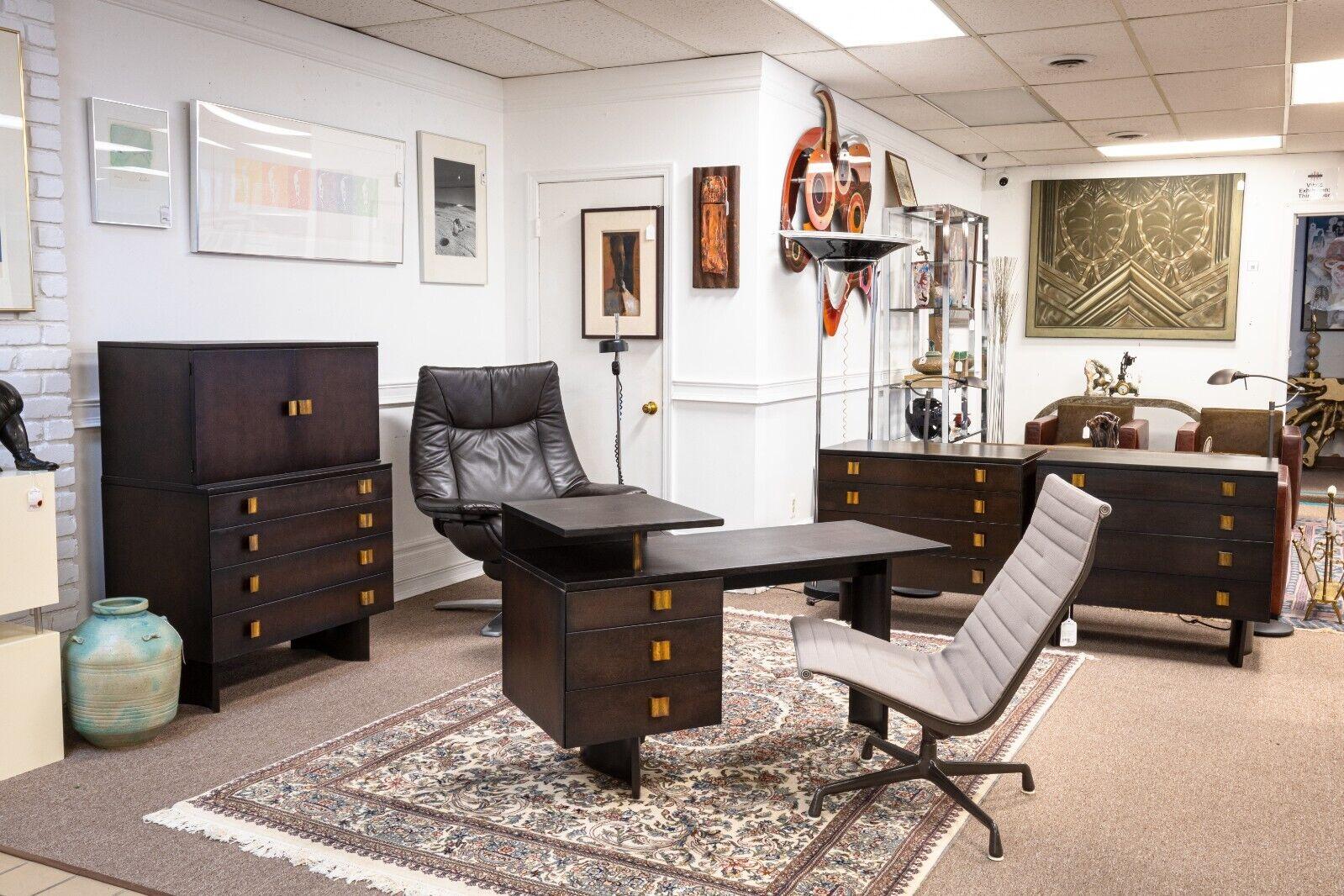 A rare Eliel Saarinen for Johnson vintage bedroom set with a desk, pair of dressers, and a highboy dresser chest cabinet. This amazing set of bedroom furniture features some incredible mid century modern furniture. All of these pieces are a part of