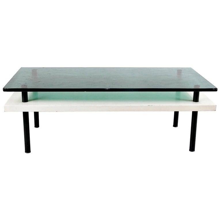 Rare first edition coffee table designed by Elmar Berkovich, circa 1930.
Manufactured by Metz and Co. (Netherlands).
Painted wood tubular legs, wood shelve and thick glass top.

In original condition, with minor wear consistent with age and use,