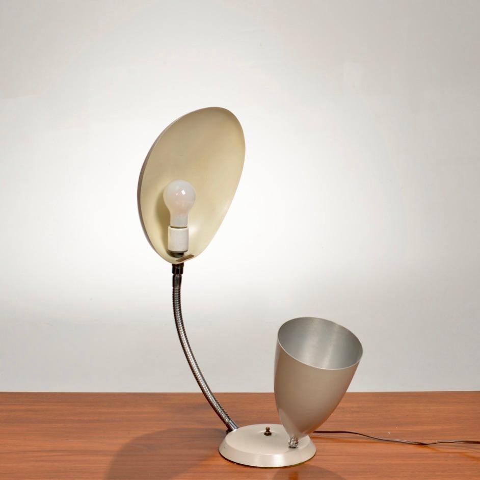 This lamp is a variant of the “Cobra” lamp which won the Good Design award in 1950 and was exhibited at the Good Design Show at the Museum of Modern Art in New York City. These lamps were originally designed for Barker Brothers but were later