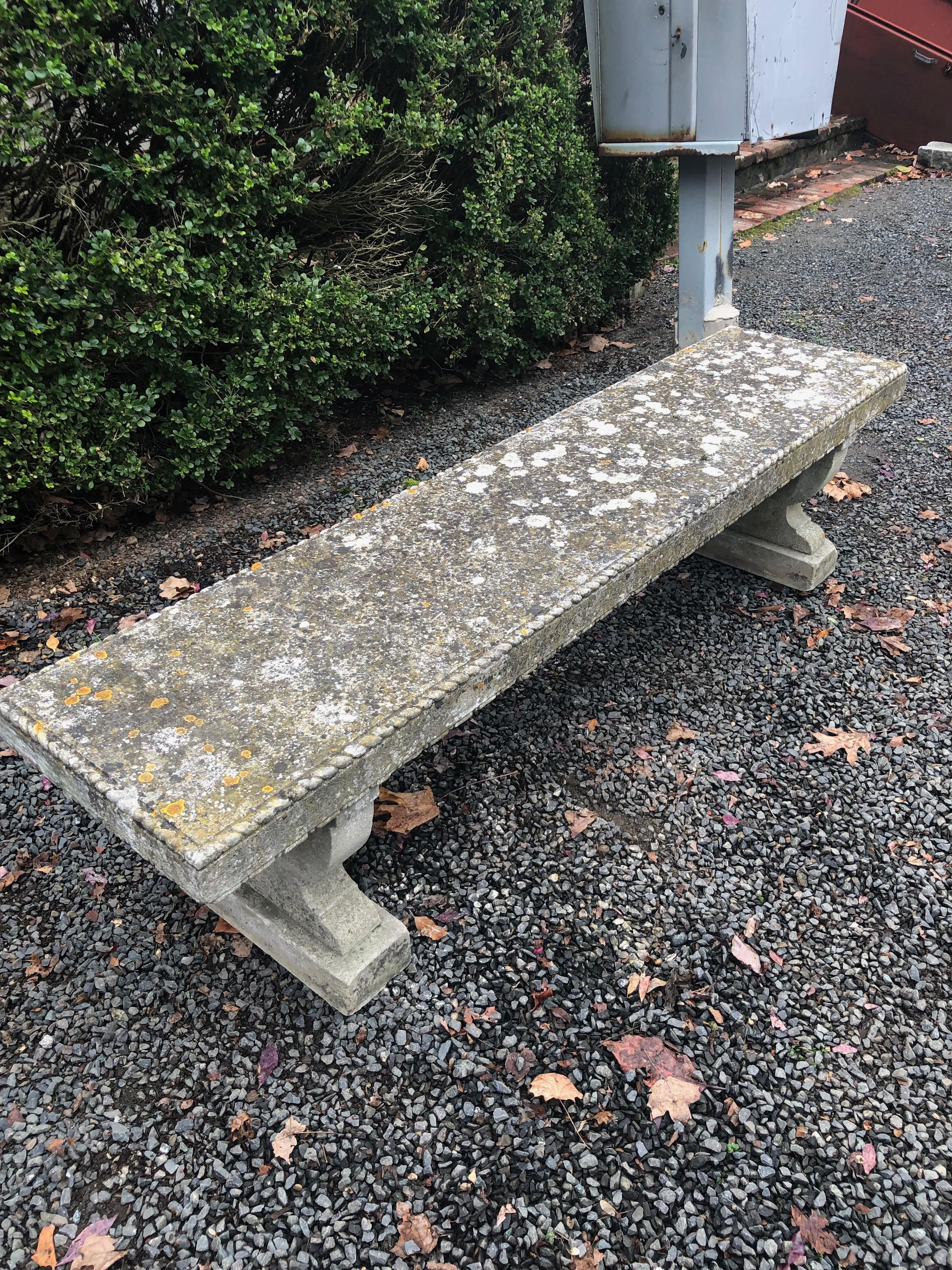 This rare-form bench is hand-carved and has been certified by a geologist as Portland Stone, the primary stone used in England for building facades during the 18th and 19th centuries. It features a stunning roped-edge decoration to the top, as well